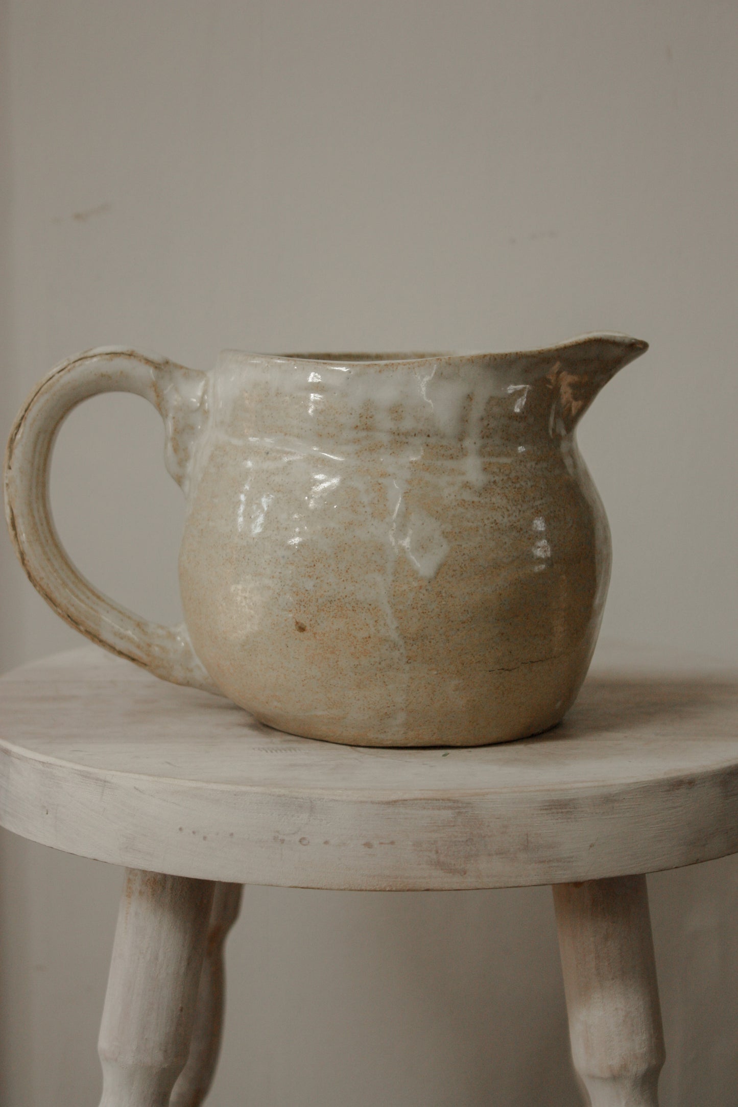 Vintage studio pottery pitcher with wheat design
