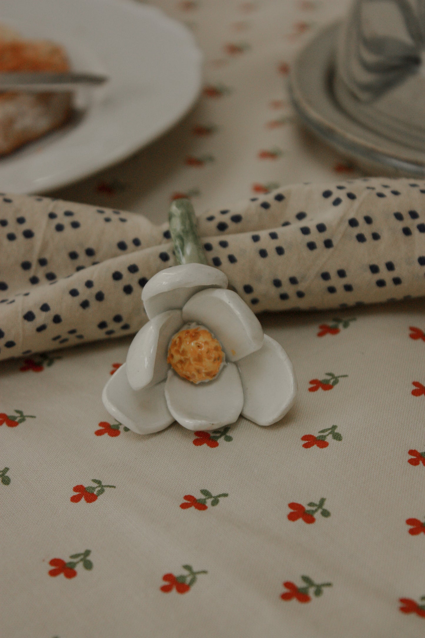 Set of four folk art pottery flower napkin rings