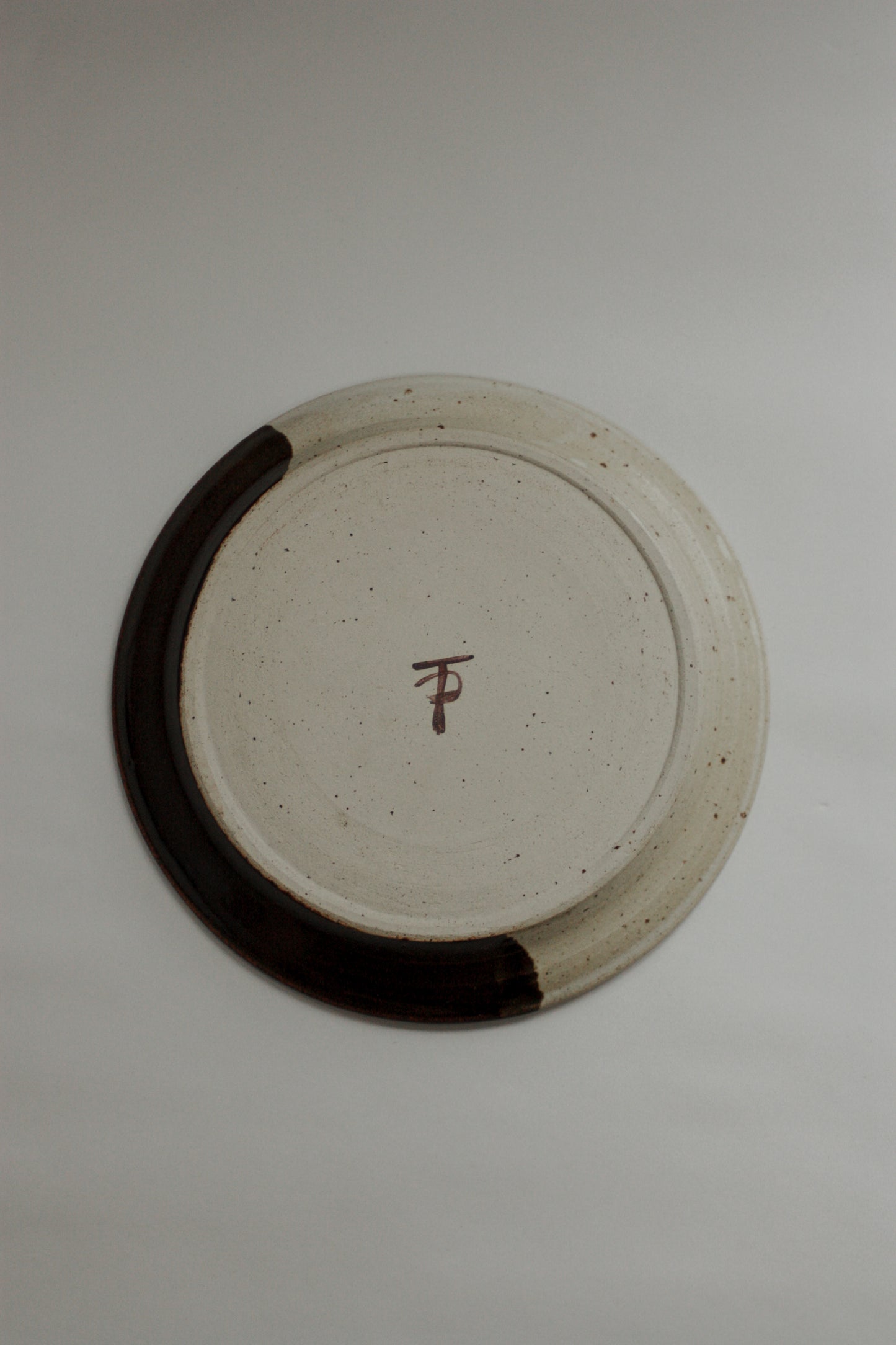 Vintage studio pottery plate - home on the horizon