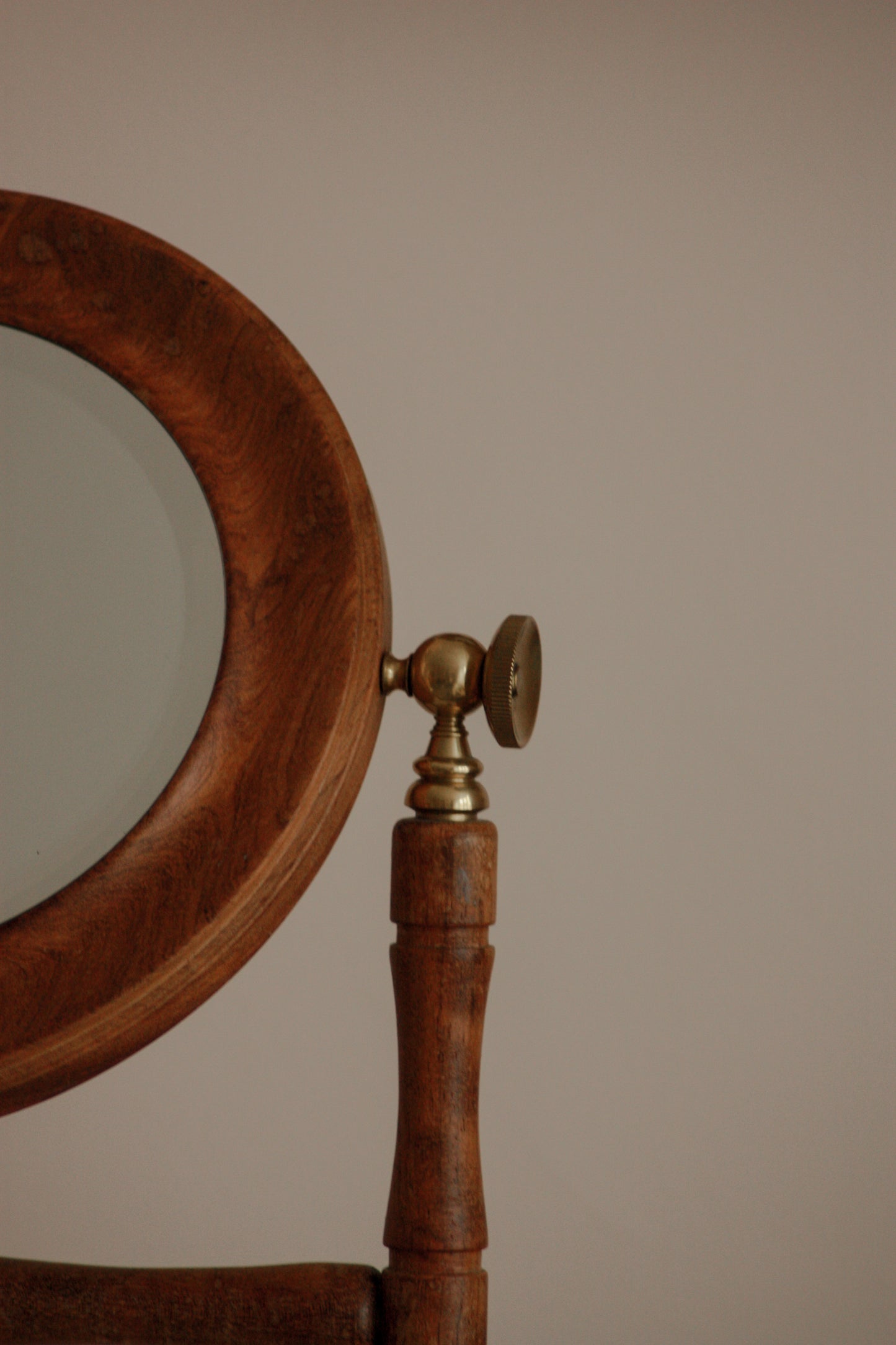 Vintage free-standing bevelled mirror with brass details