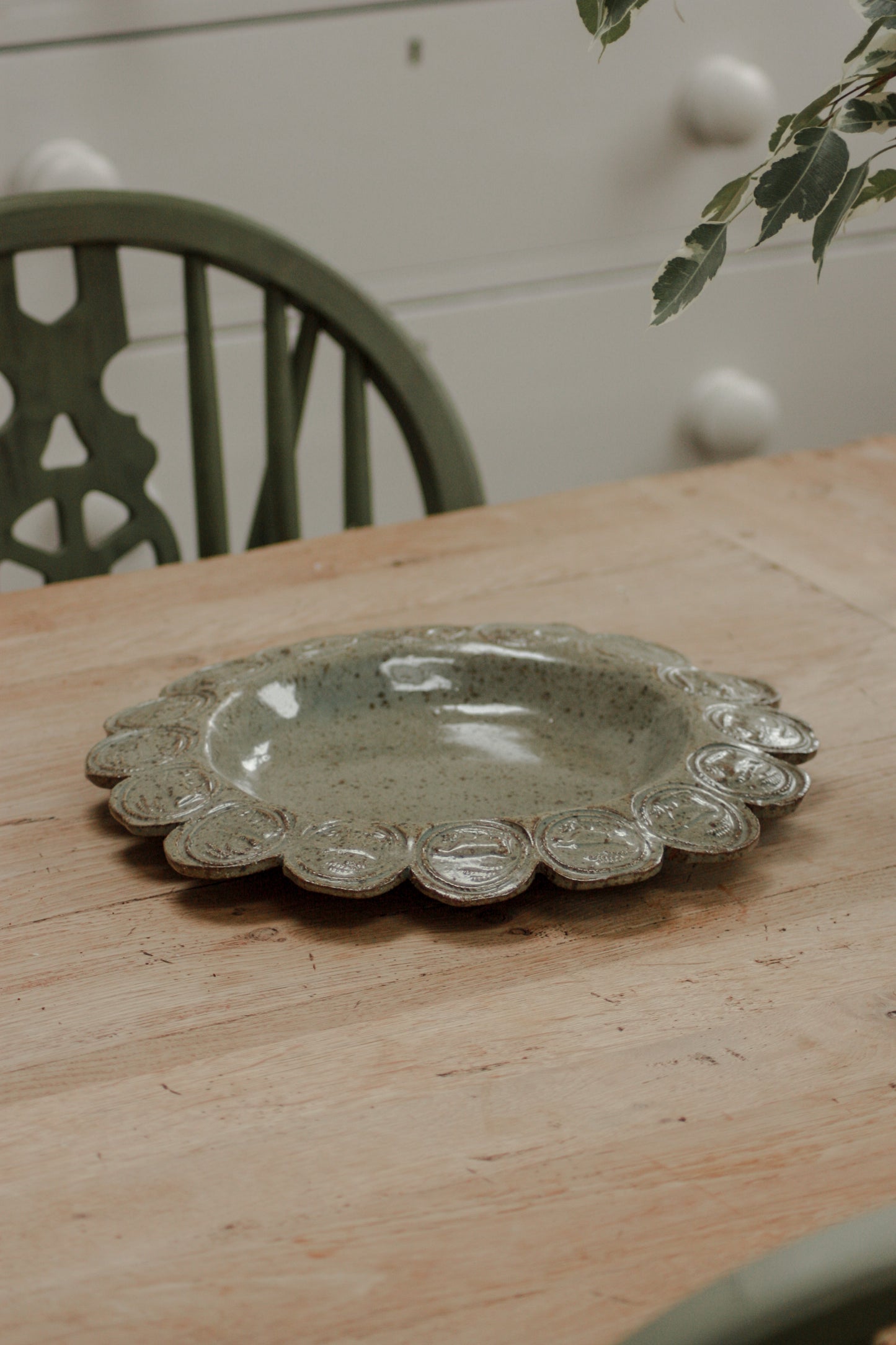 Vintage studio pottery dish with cow stamp motif