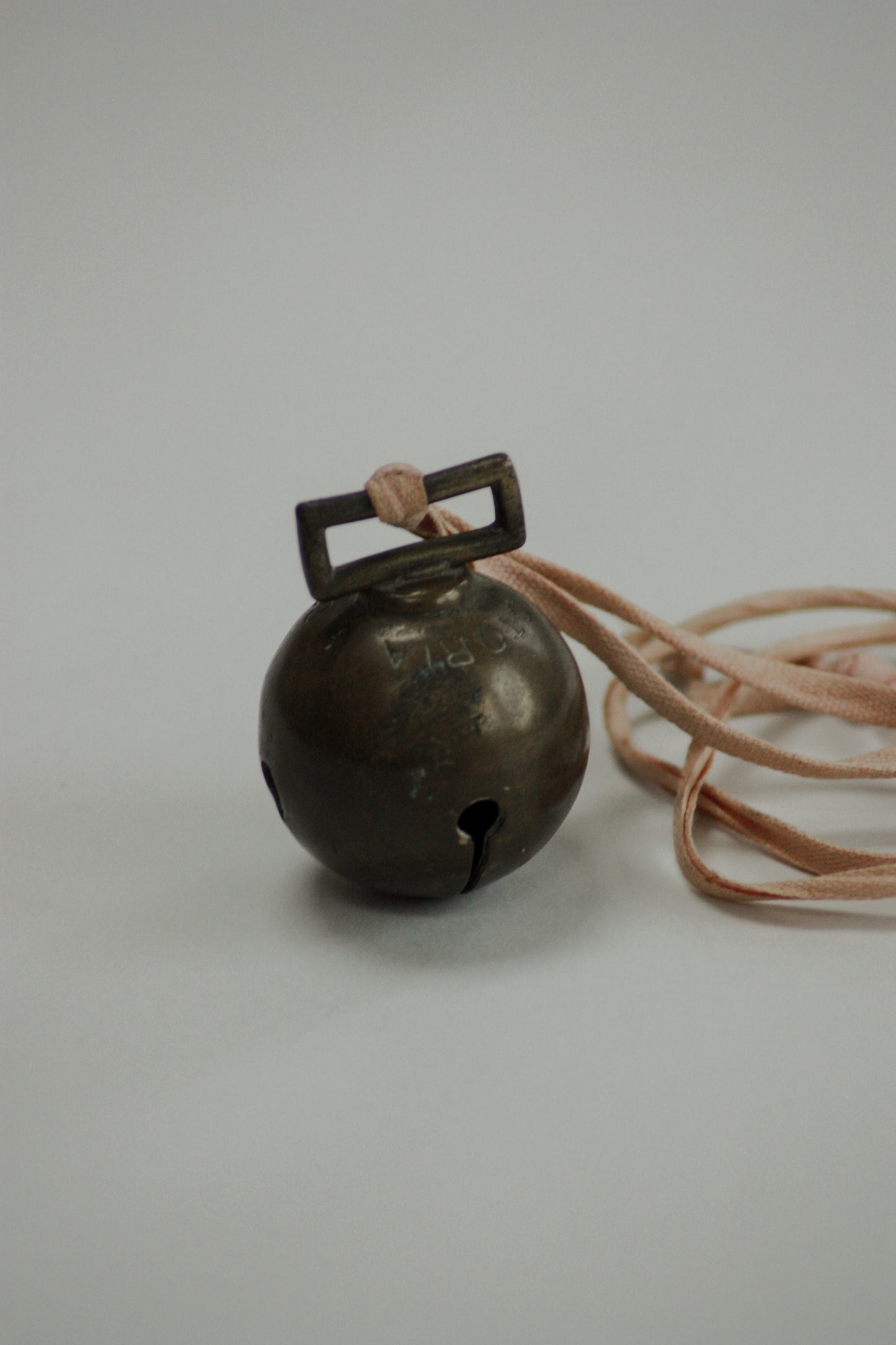 Antique Victorian carriage bell on powder pink vintage ribbon