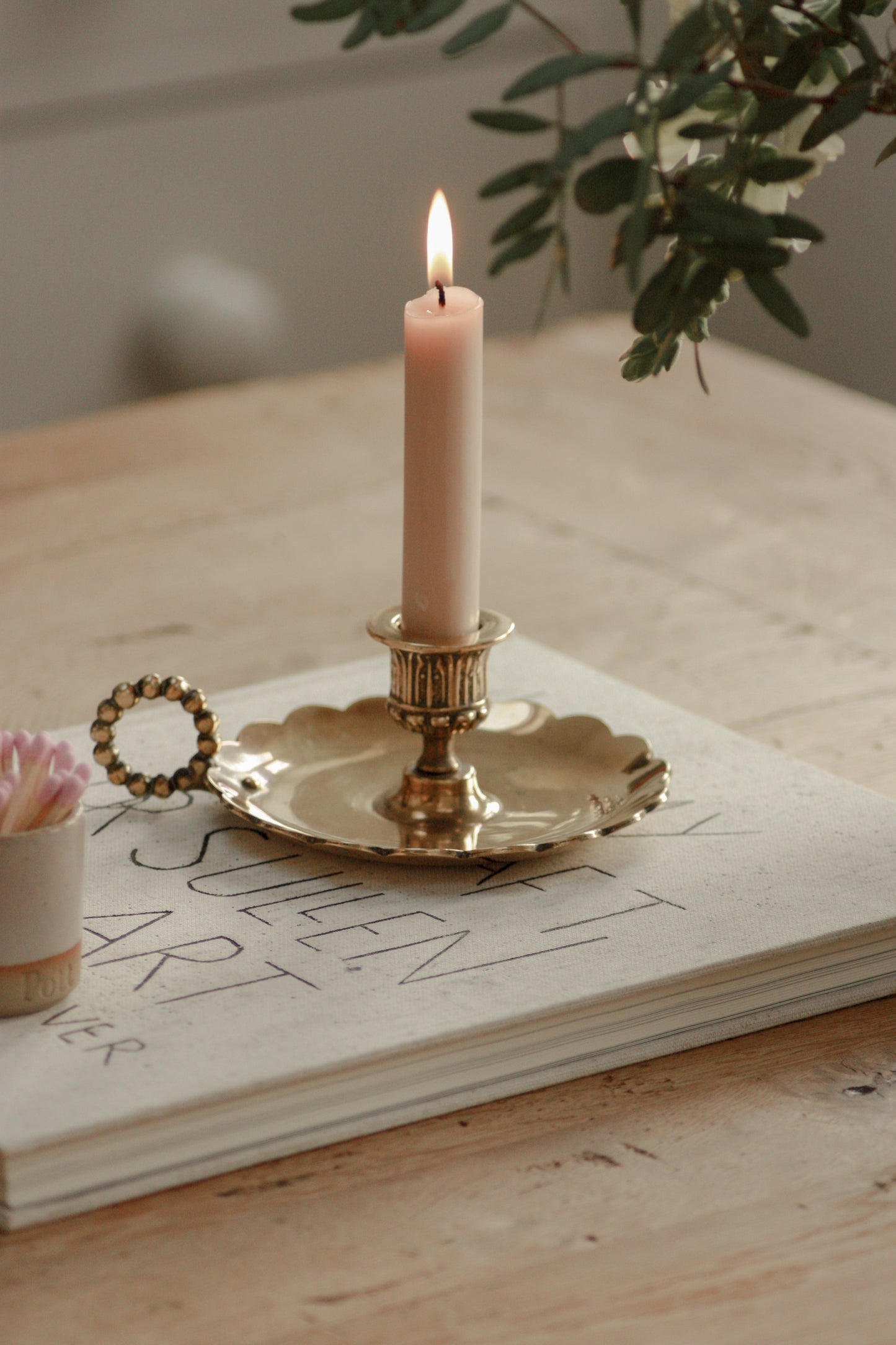 Vintage English brass chamberstick with scalloped handle