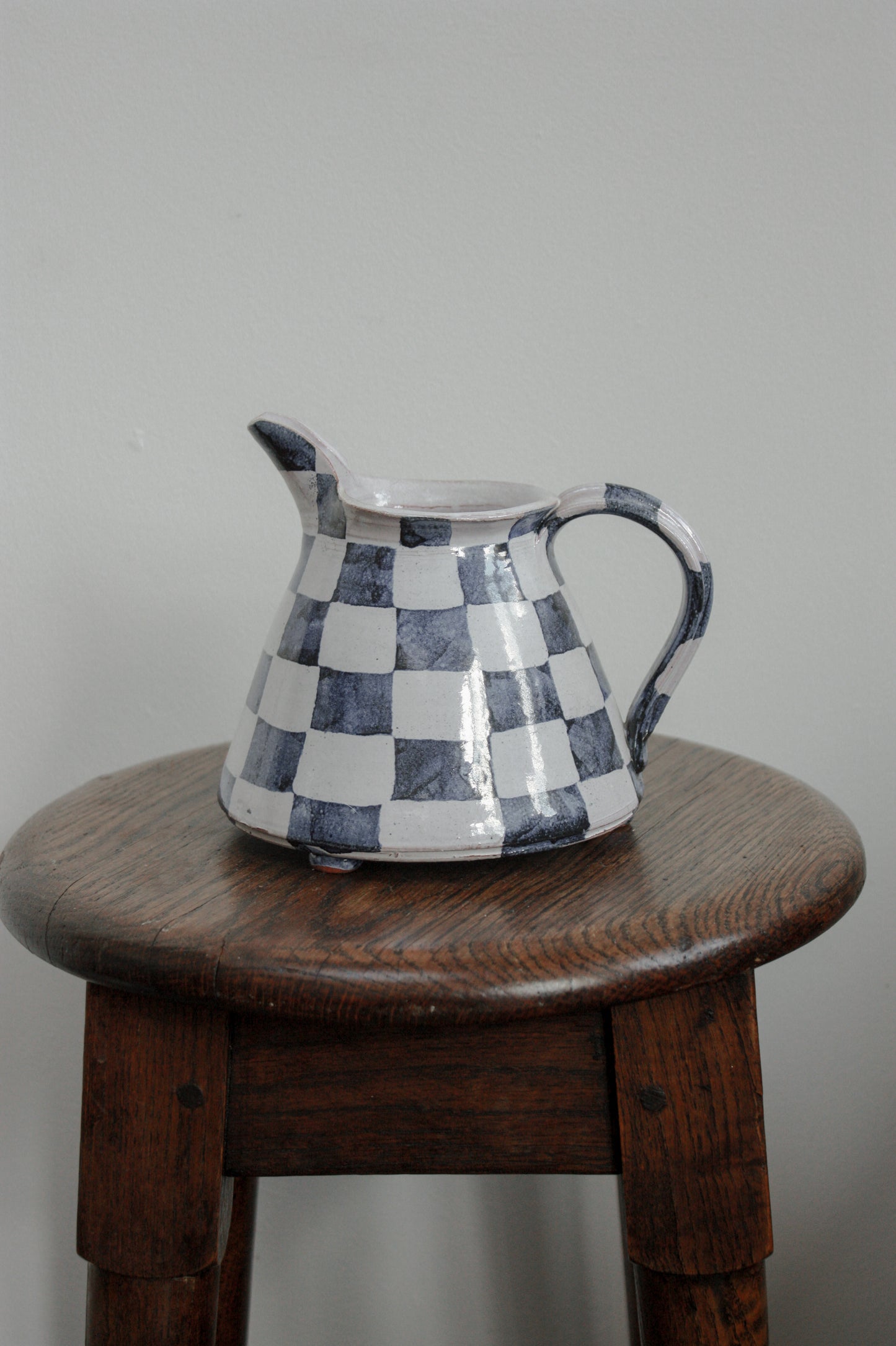 Studio pottery hand painted check jug
