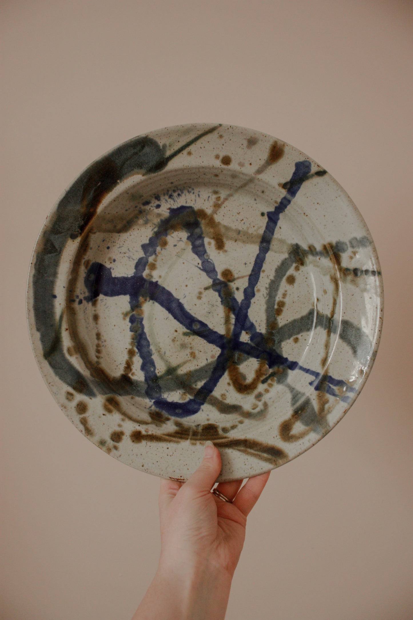 Studio pottery dish with abstract design