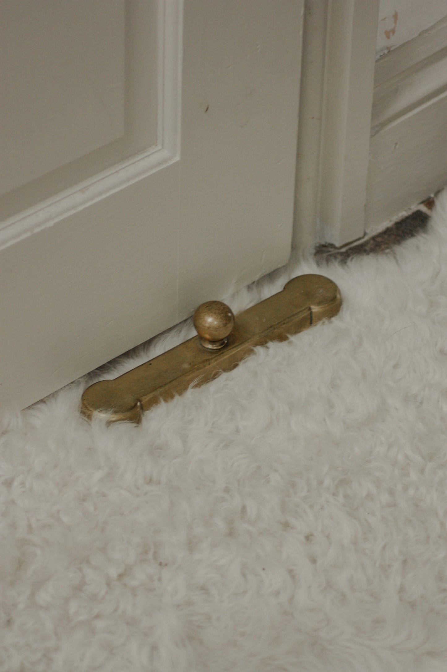Antique Victorian cast iron and brass doorstop by James Cartland & Sons