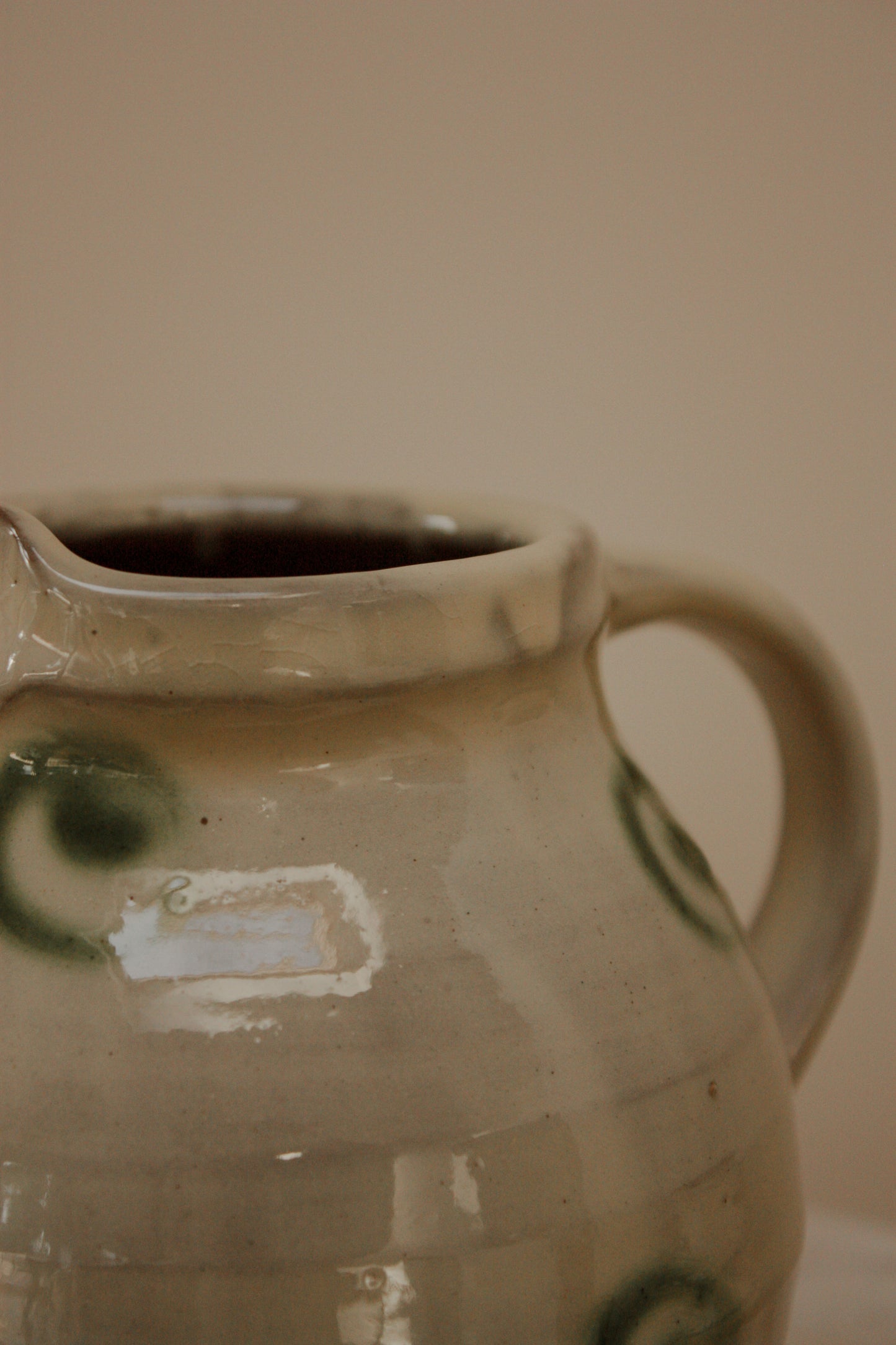 Vintage art pottery jug with swirl design