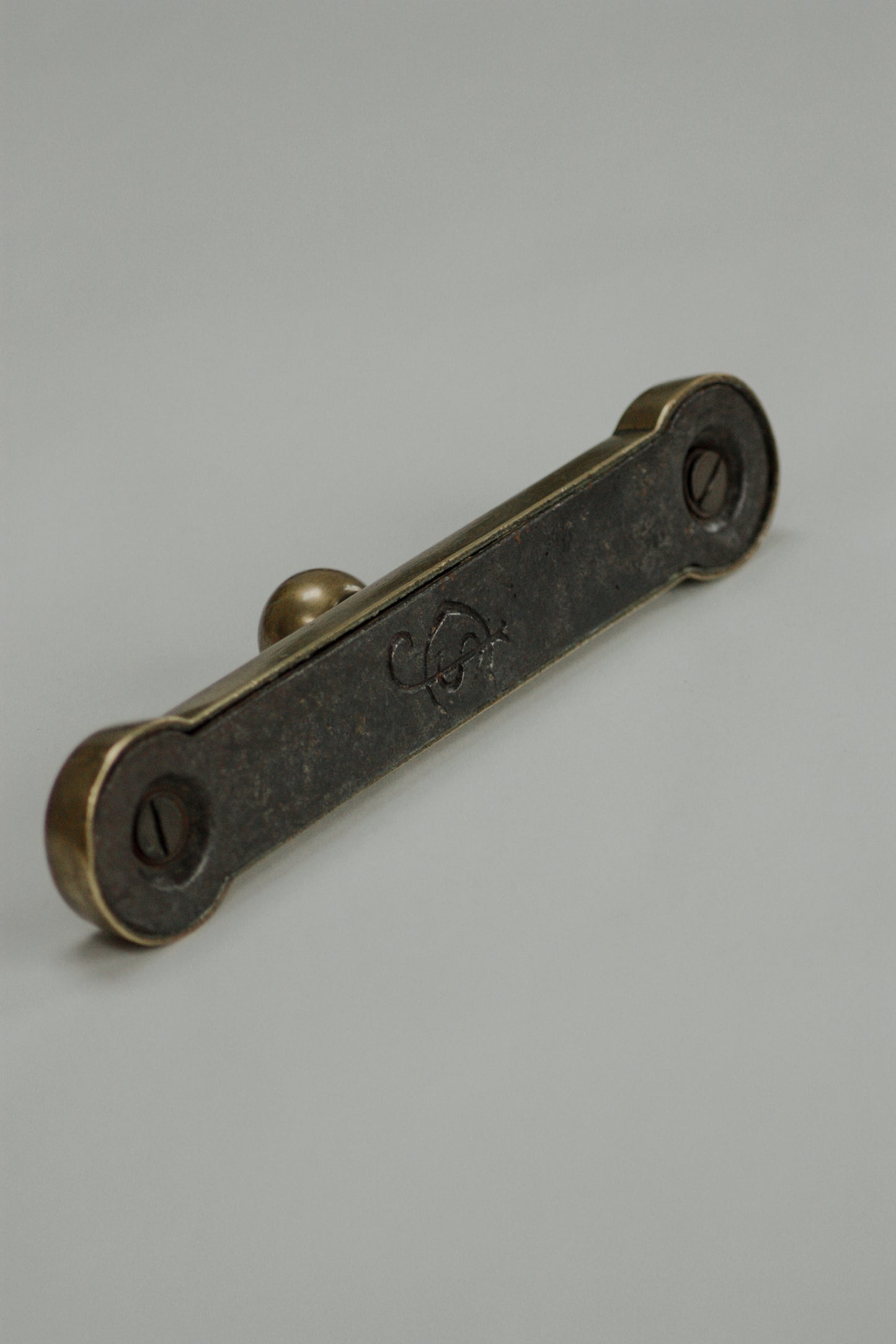 Antique Victorian cast iron and brass doorstop by James Cartland & Sons
