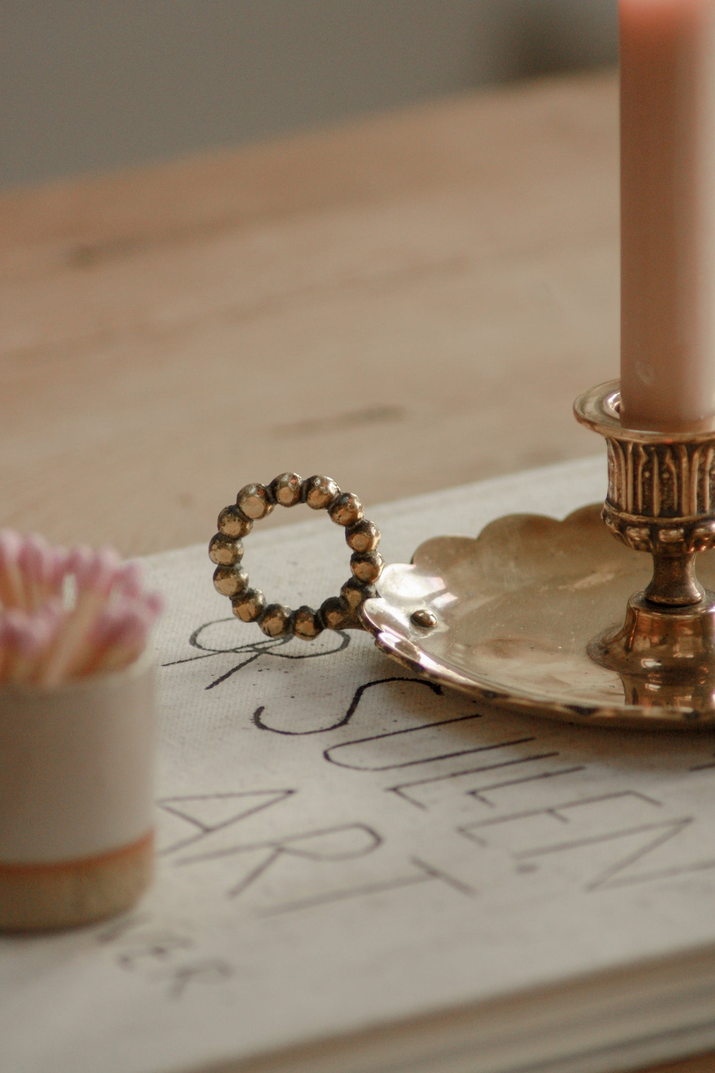 Vintage English brass chamberstick with scalloped handle