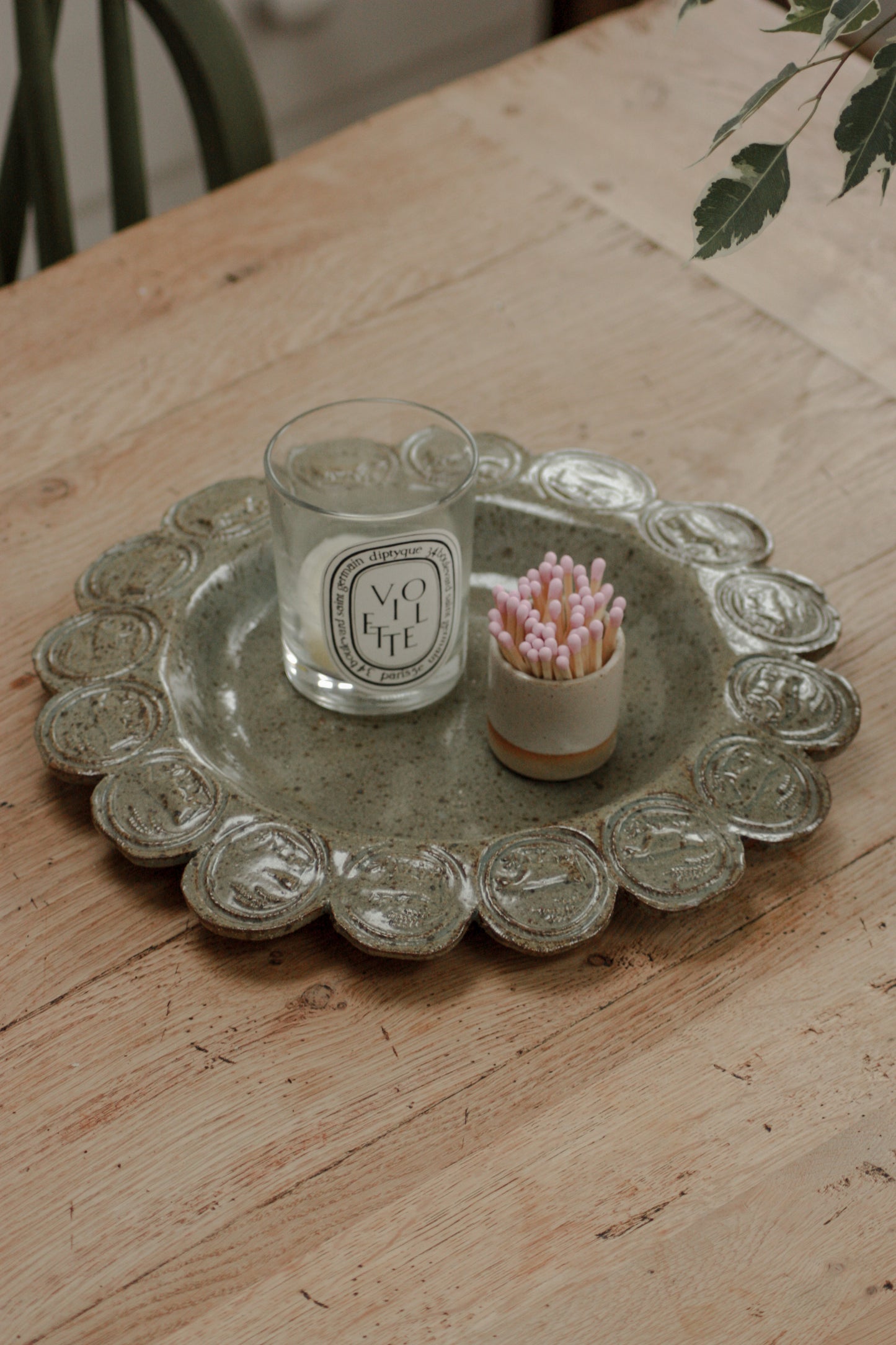 Vintage studio pottery dish with cow stamp motif