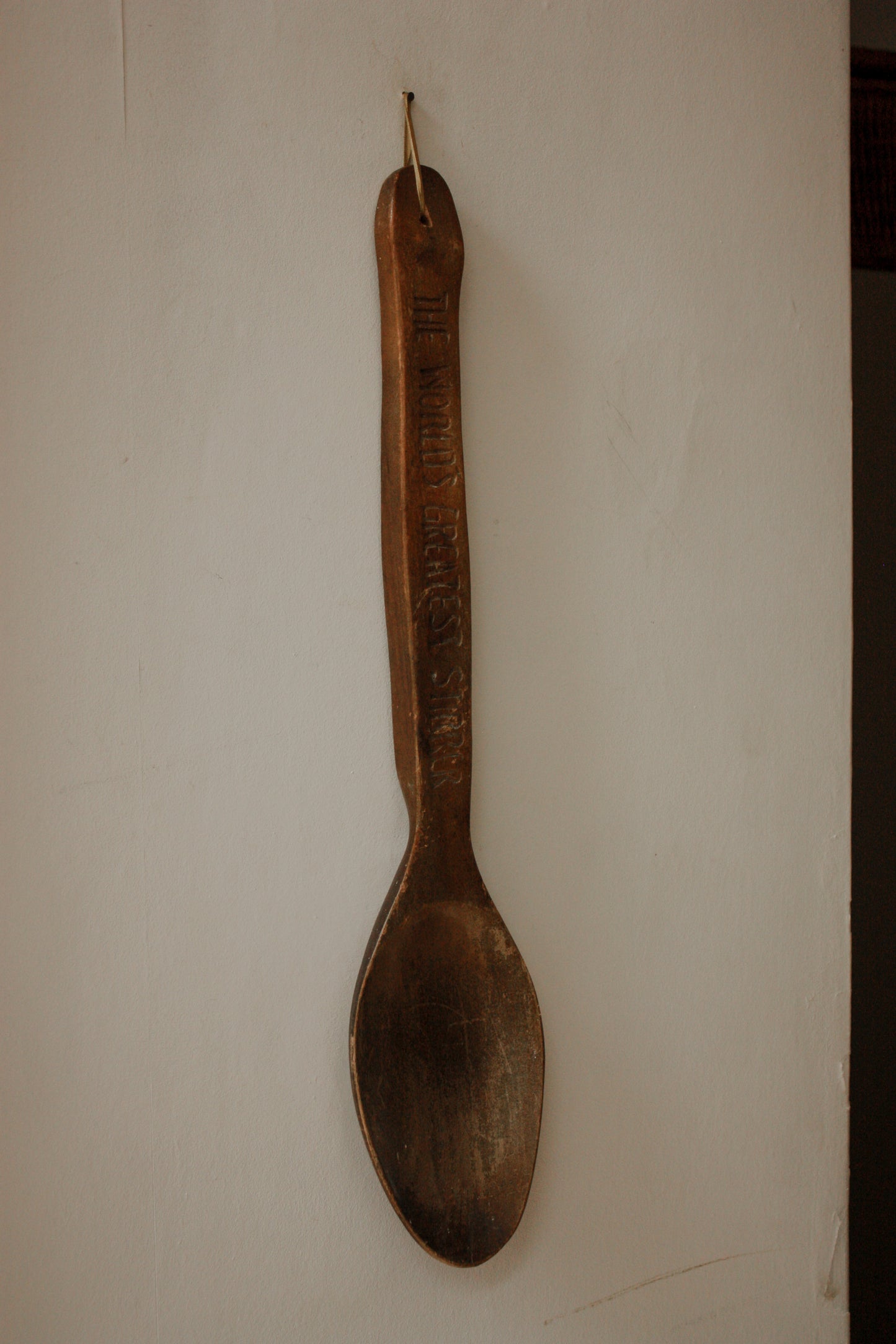 Hand carved wall hanging wooden spoon - World’s Greatest Stirrer