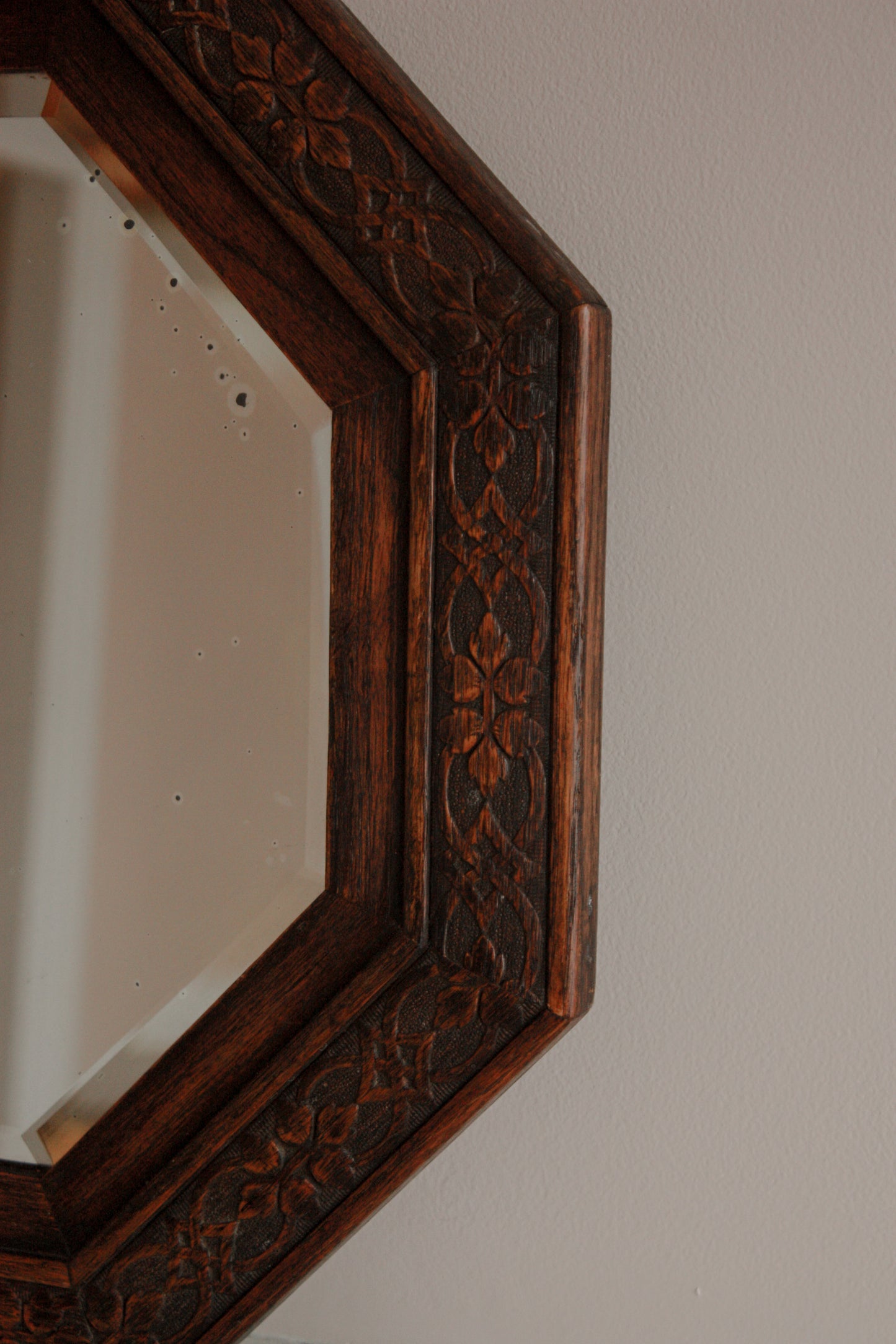 Vintage 1940s hexagon mirror with carved floral details