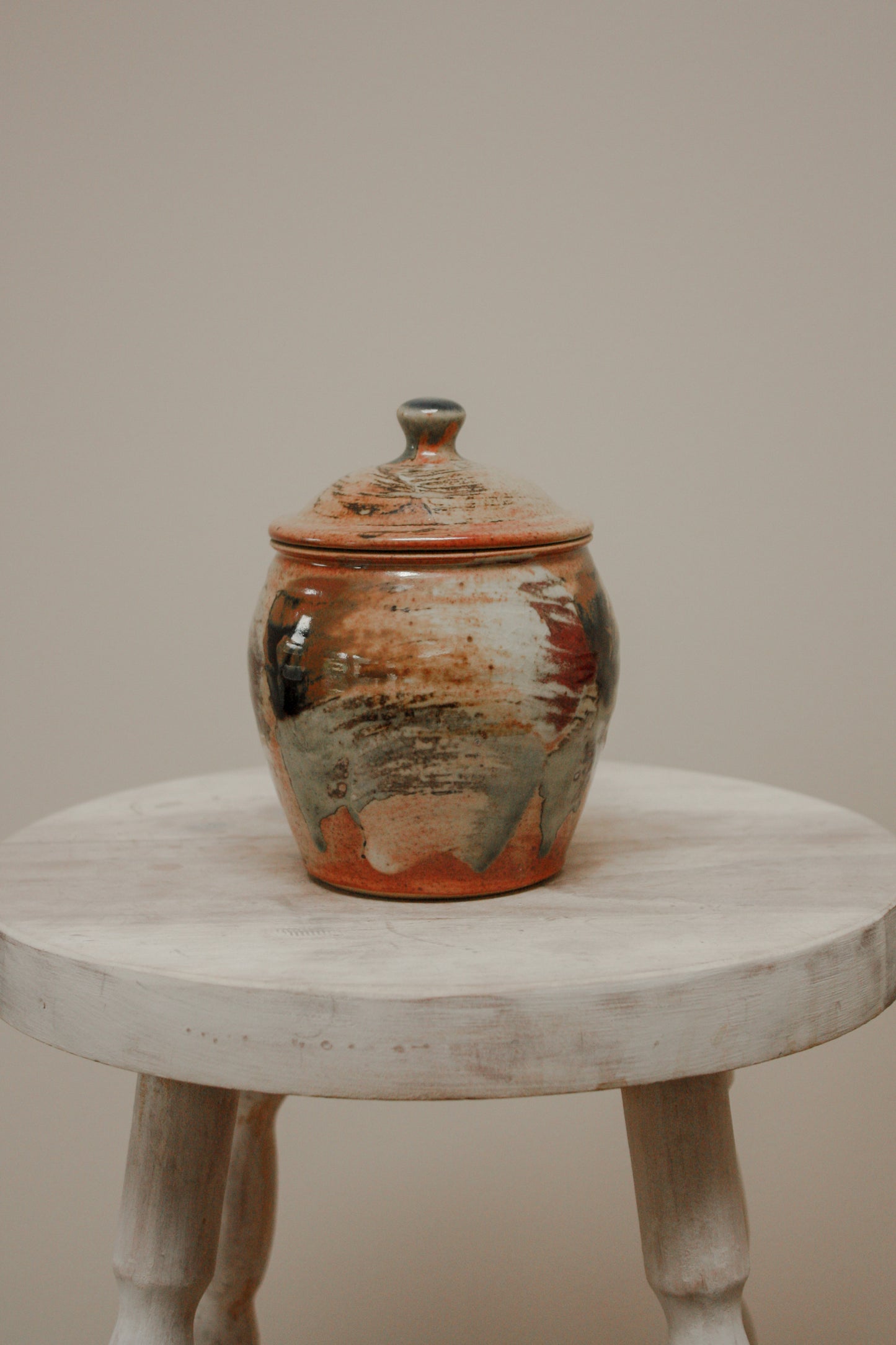 Studio pottery lidded pot with brushed watercolour design