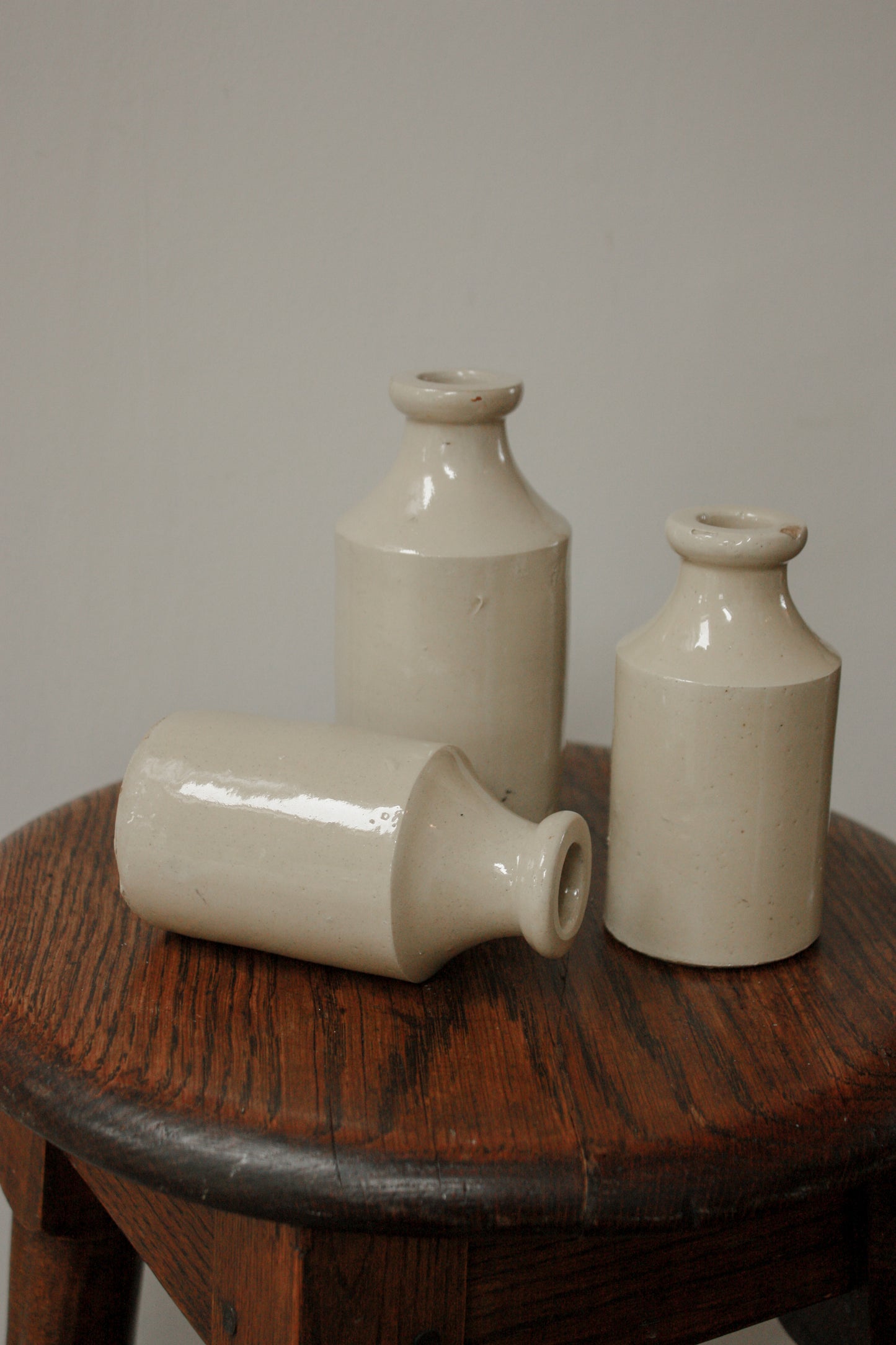 Set of three vintage stoneware bottles