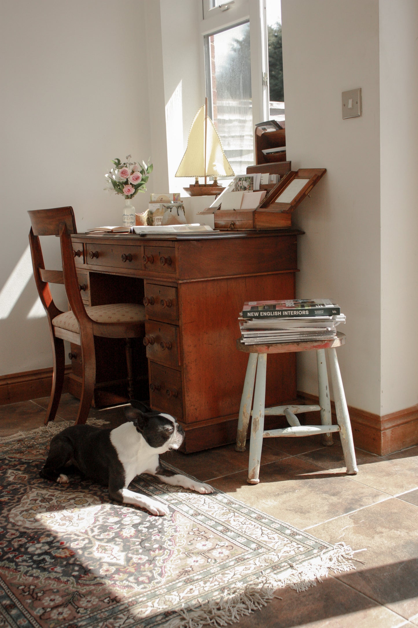 Vintage wooden stool with chippy blue painted legs