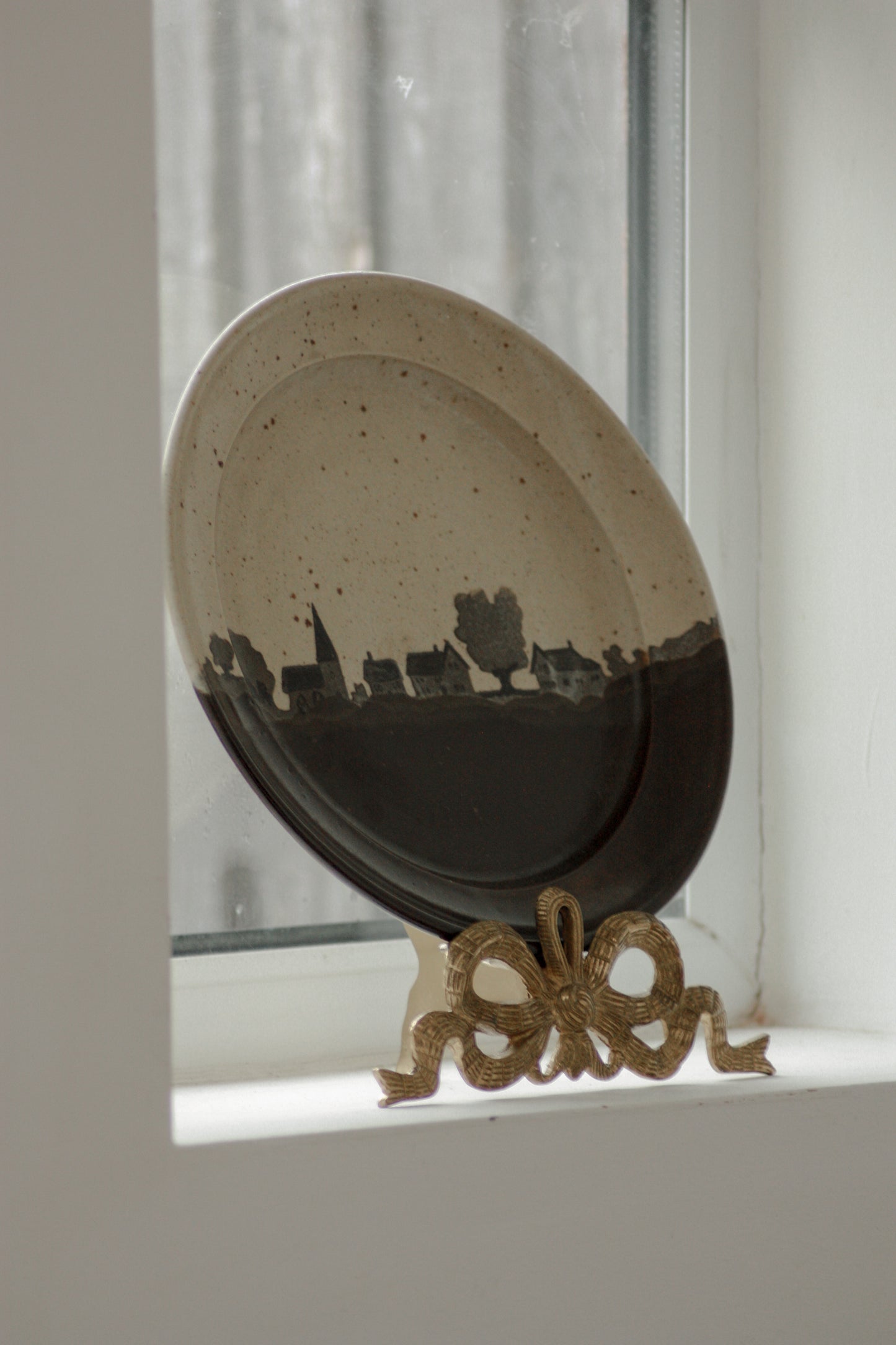 Vintage studio pottery plate - home on the horizon