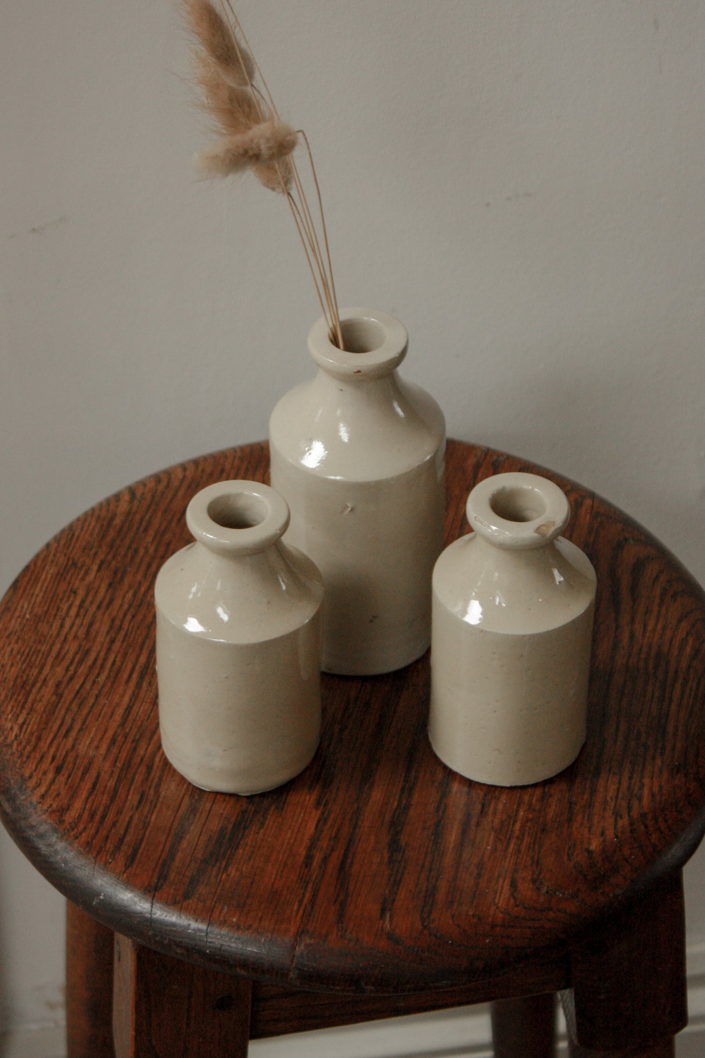 Set of three vintage stoneware bottles