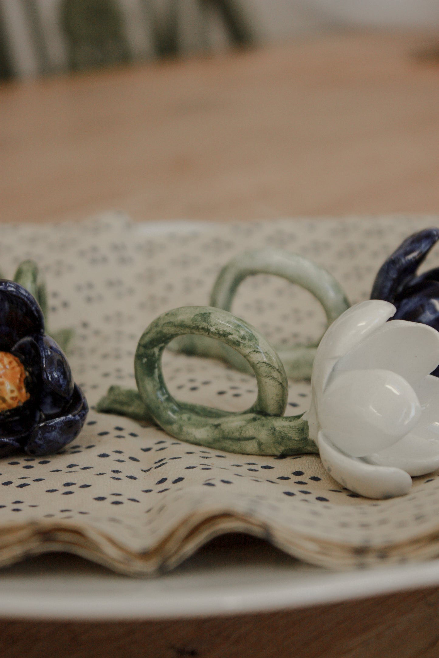 Set of four folk art pottery flower napkin rings