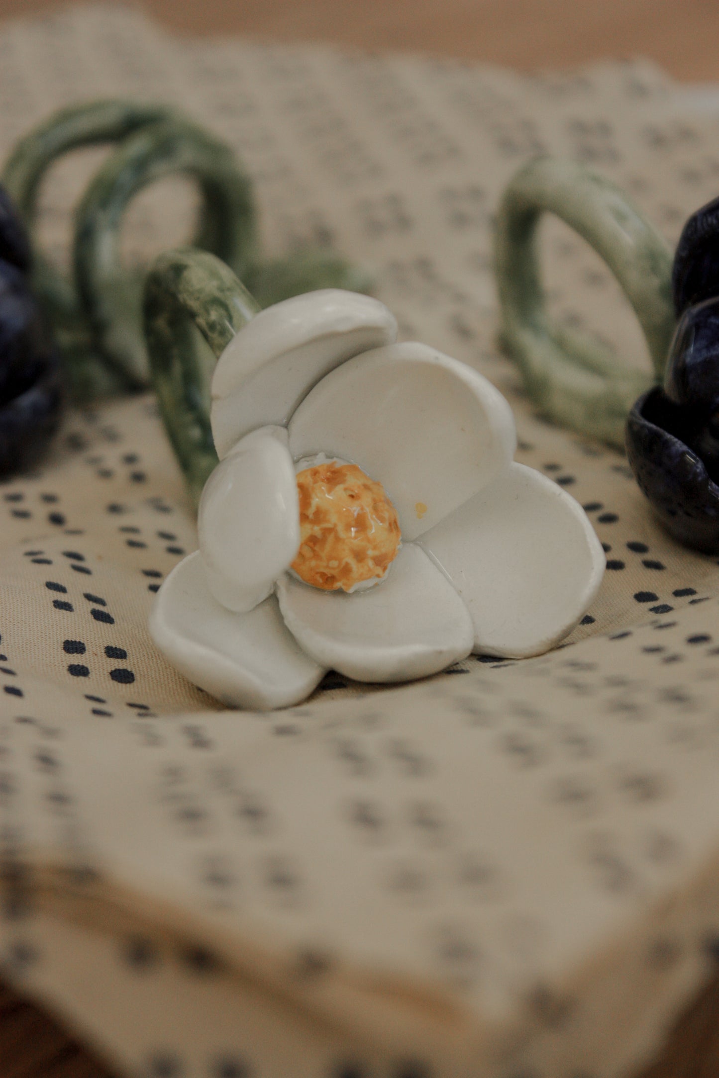 Set of four folk art pottery flower napkin rings