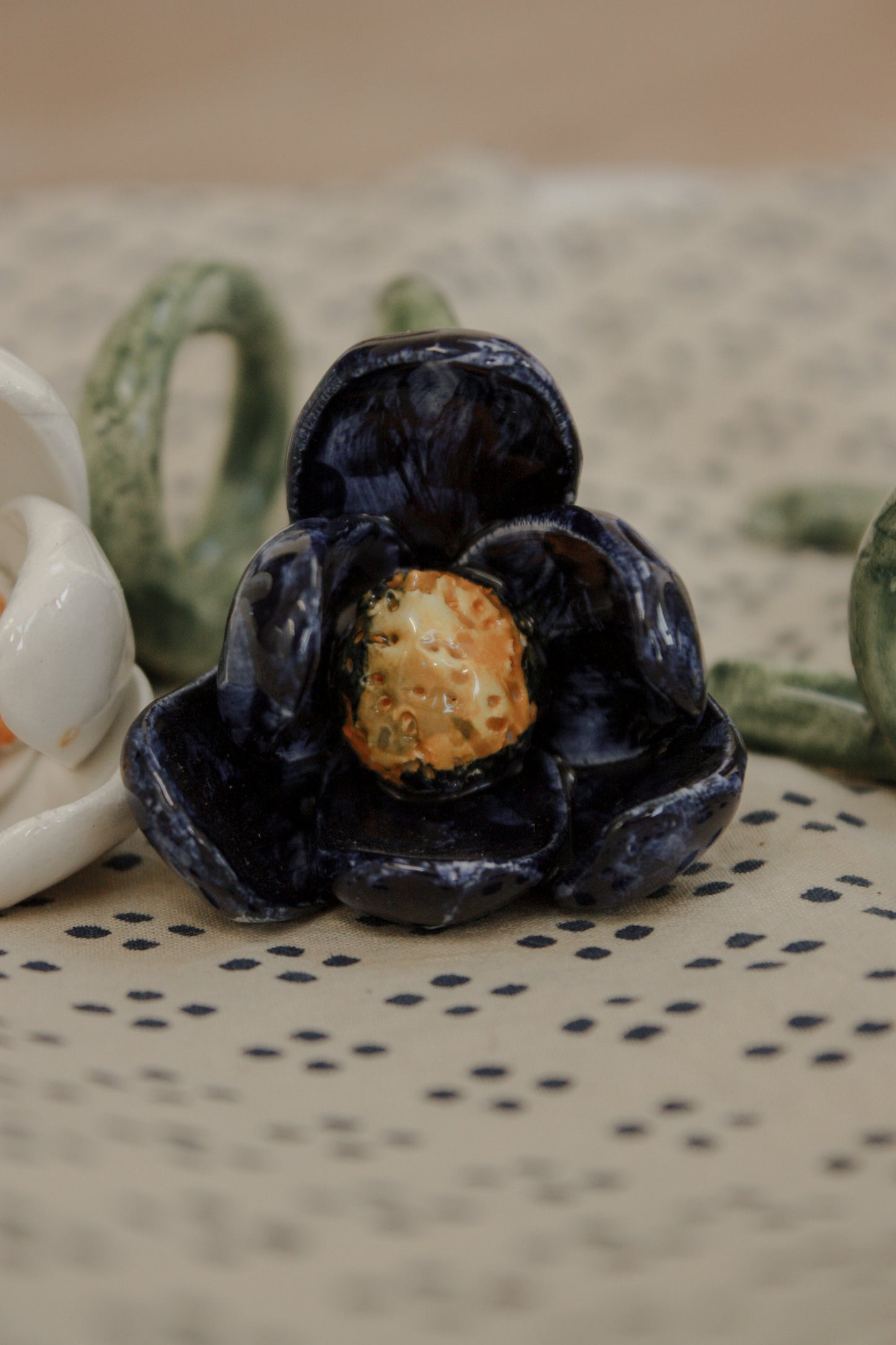 Set of four folk art pottery flower napkin rings