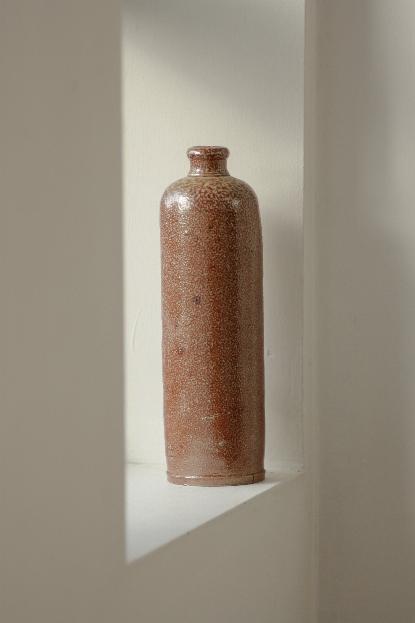 Vintage tall stoneware bottle