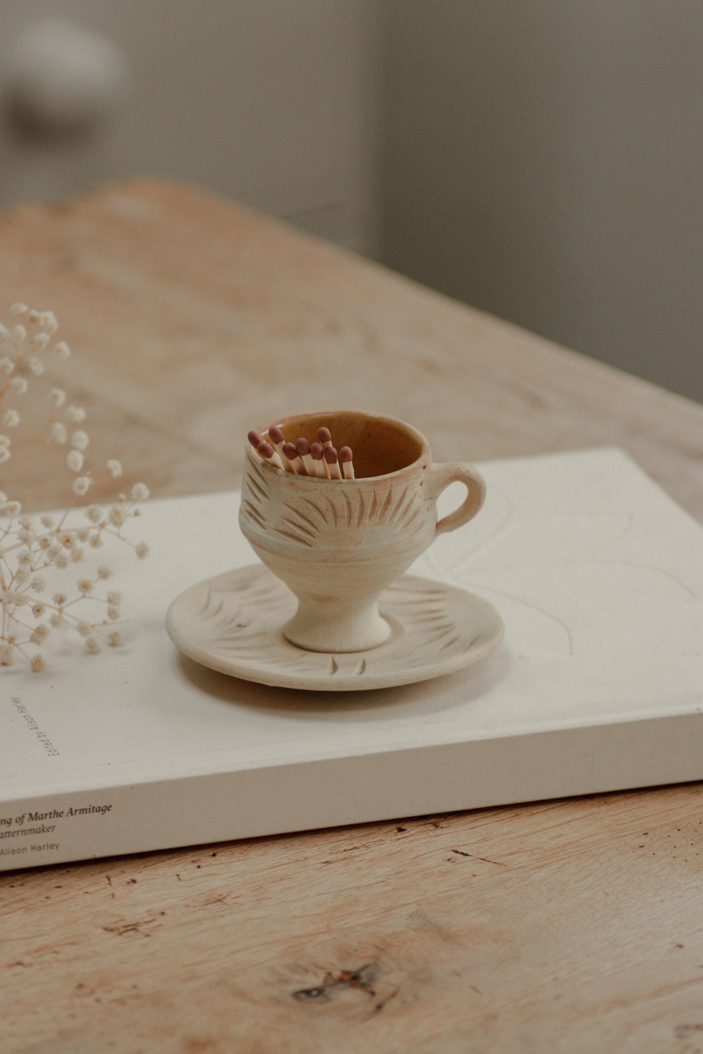 Folk art teacup and saucer matchpot