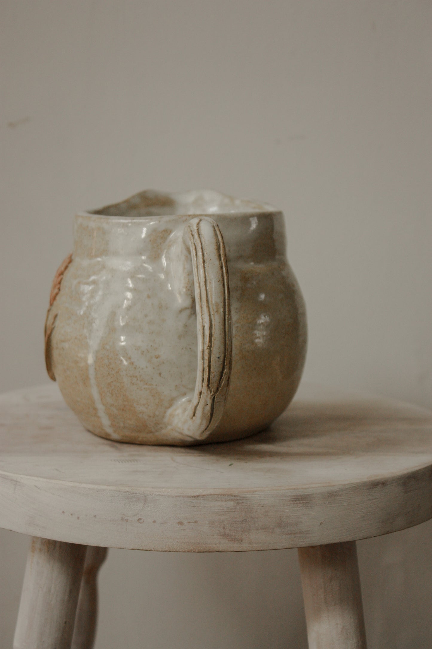 Vintage studio pottery pitcher with wheat design