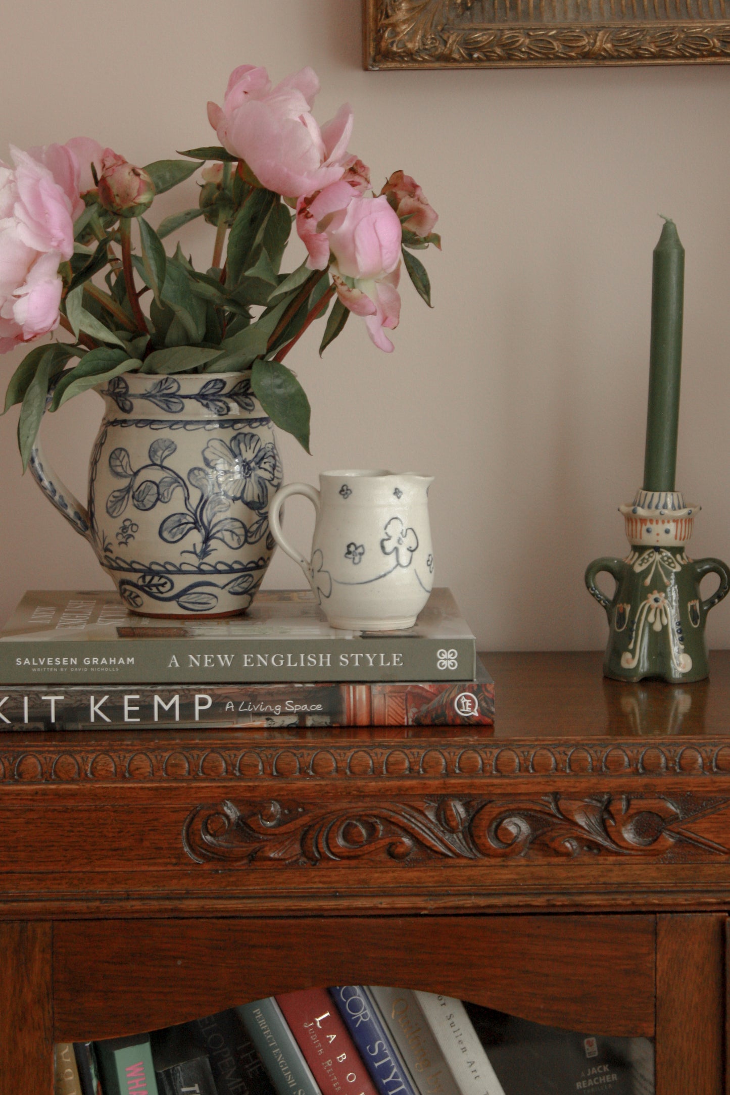 Studio pottery creamer with hand painted floral design