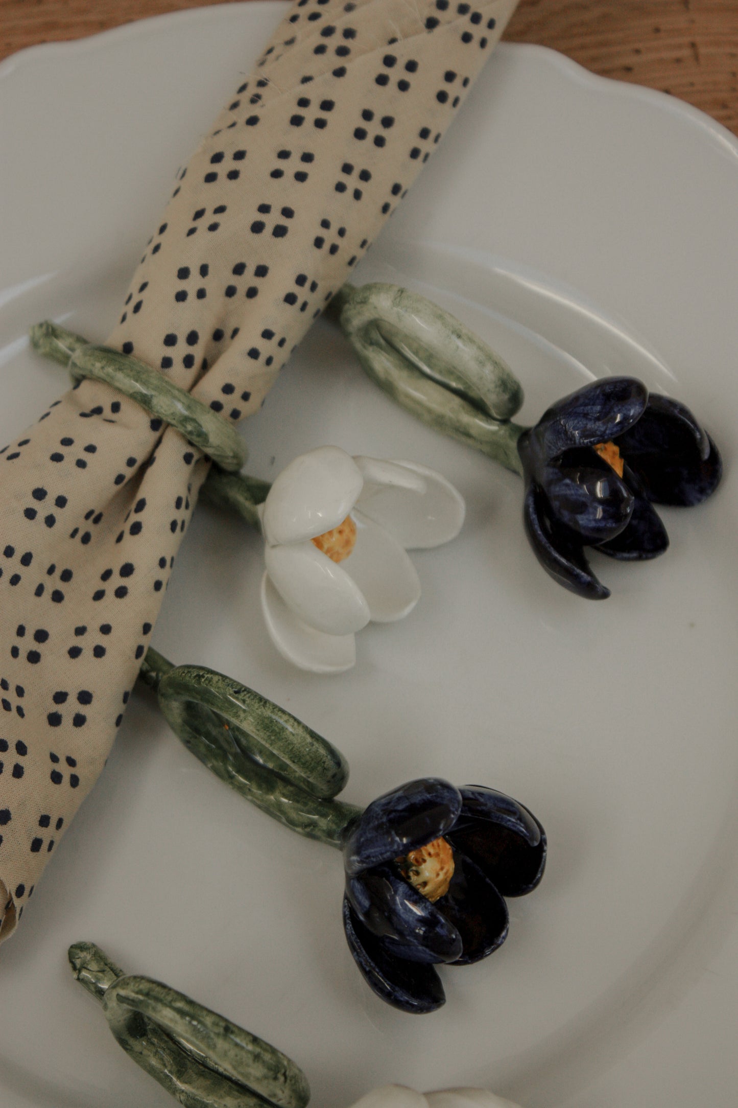 Set of four folk art pottery flower napkin rings