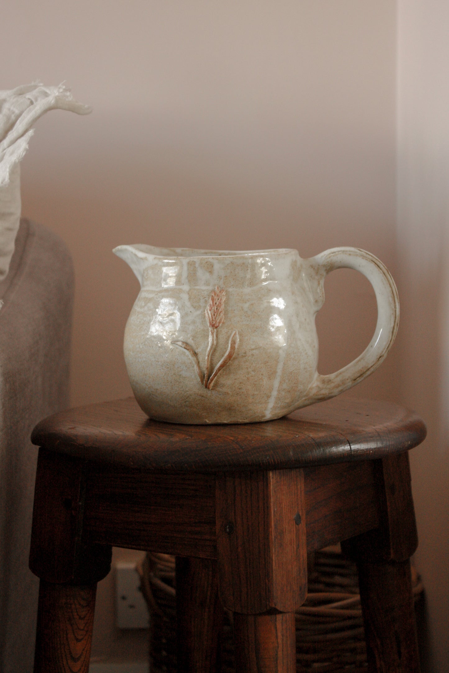 Vintage studio pottery pitcher with wheat design