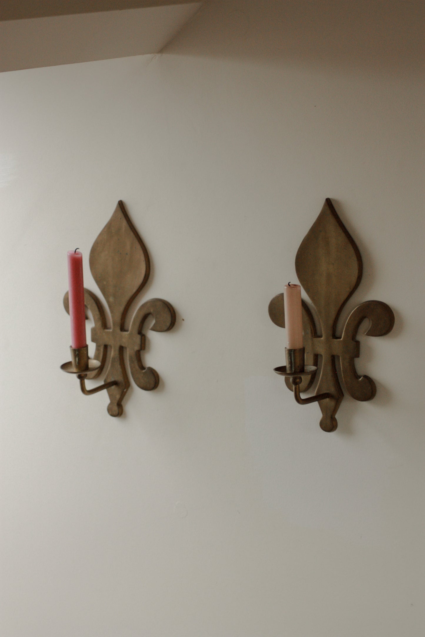 Large pair of antique brass fleur de lis candle sconces