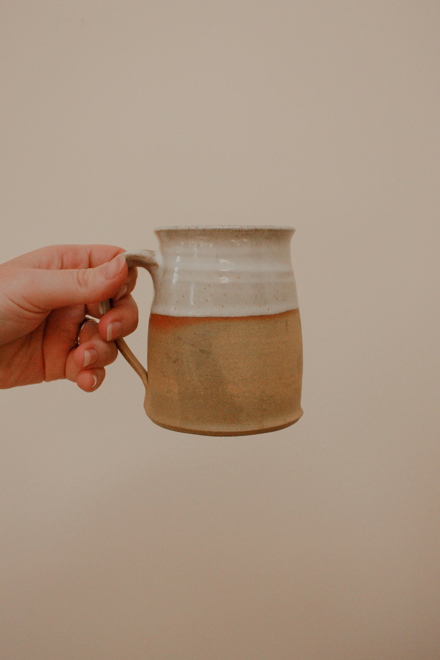 Studio pottery clay mug with rustic two tone glaze