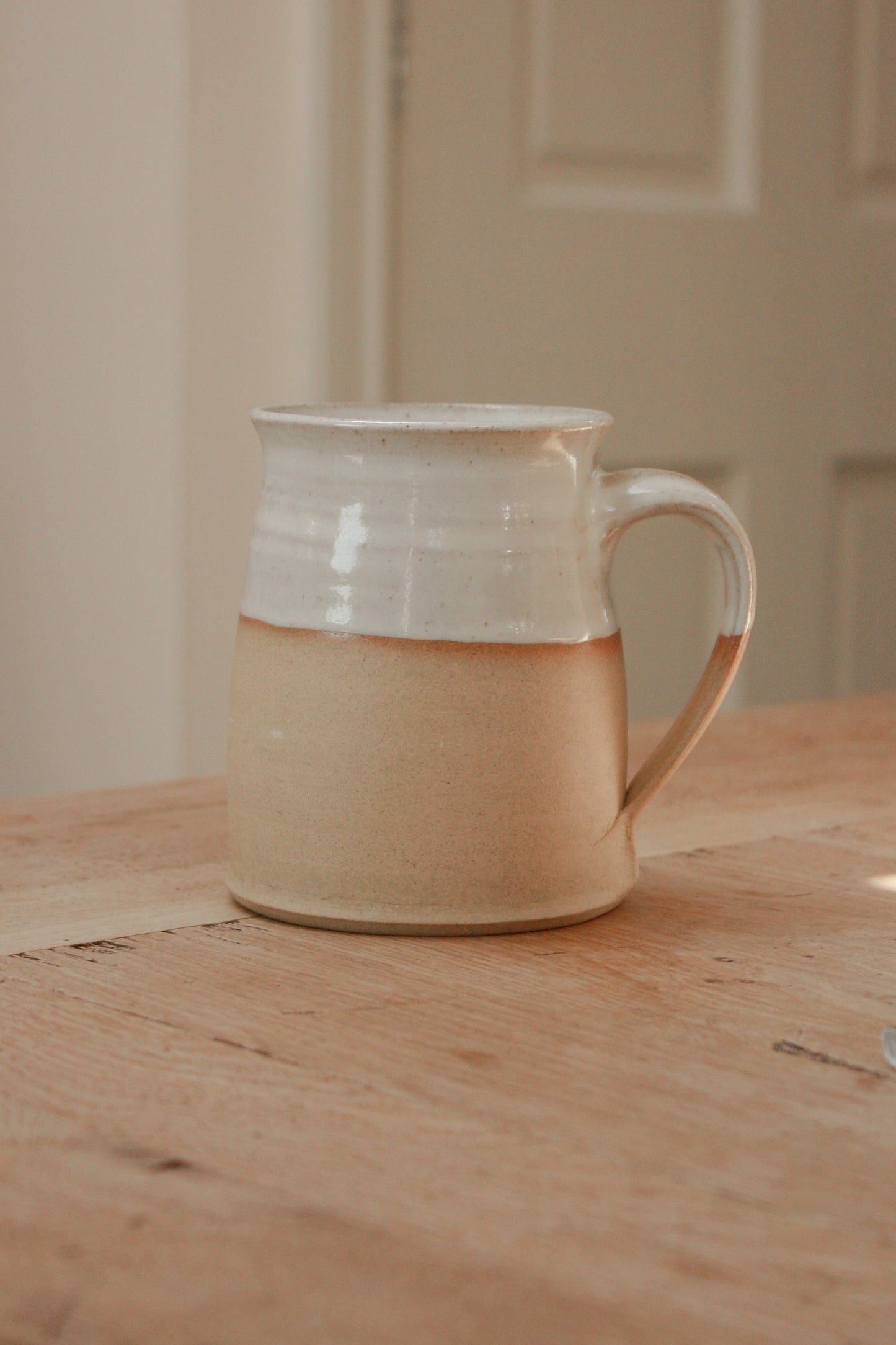 Studio pottery clay mug with rustic two tone glaze