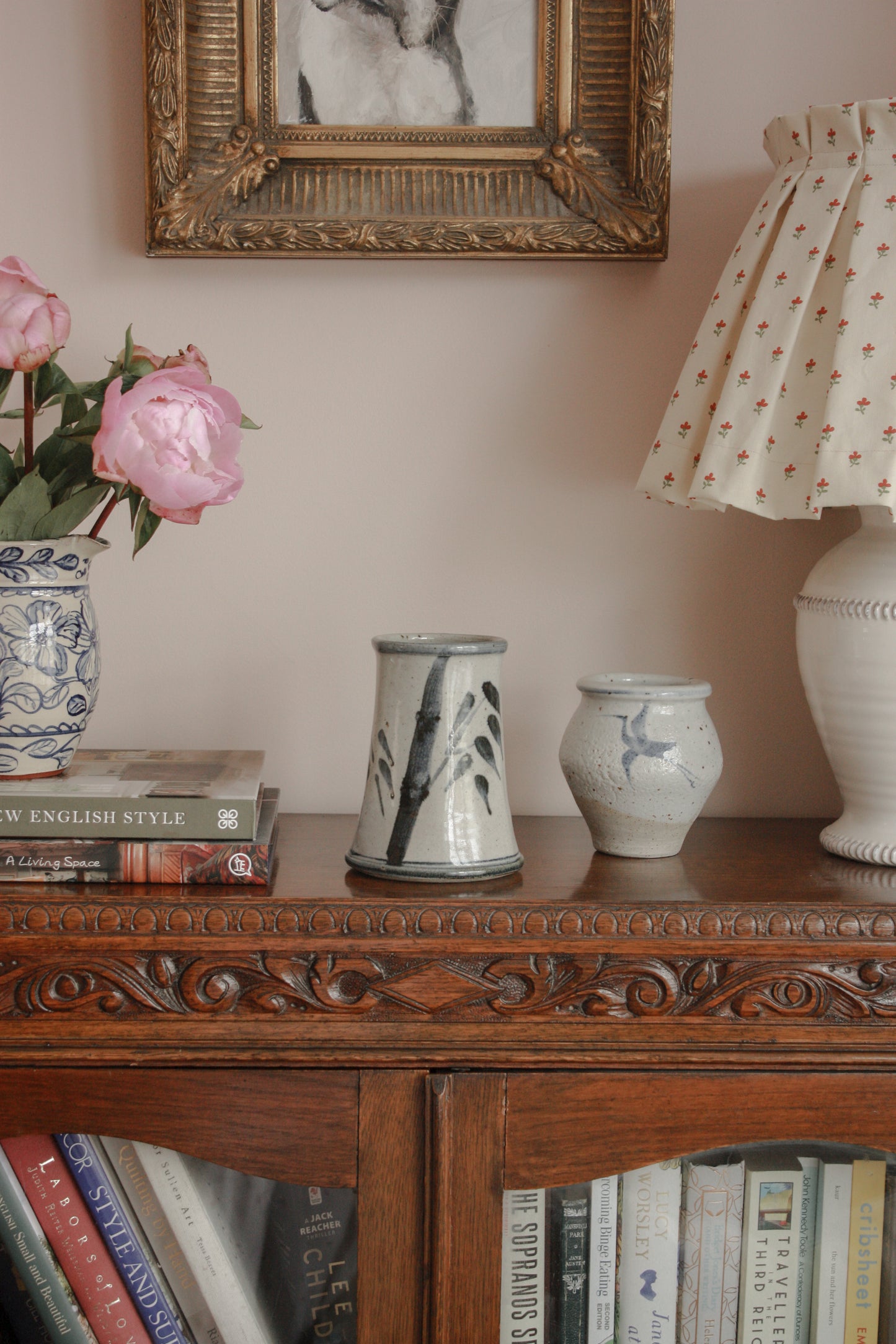 Rustic studio pottery vase with blue foliage details
