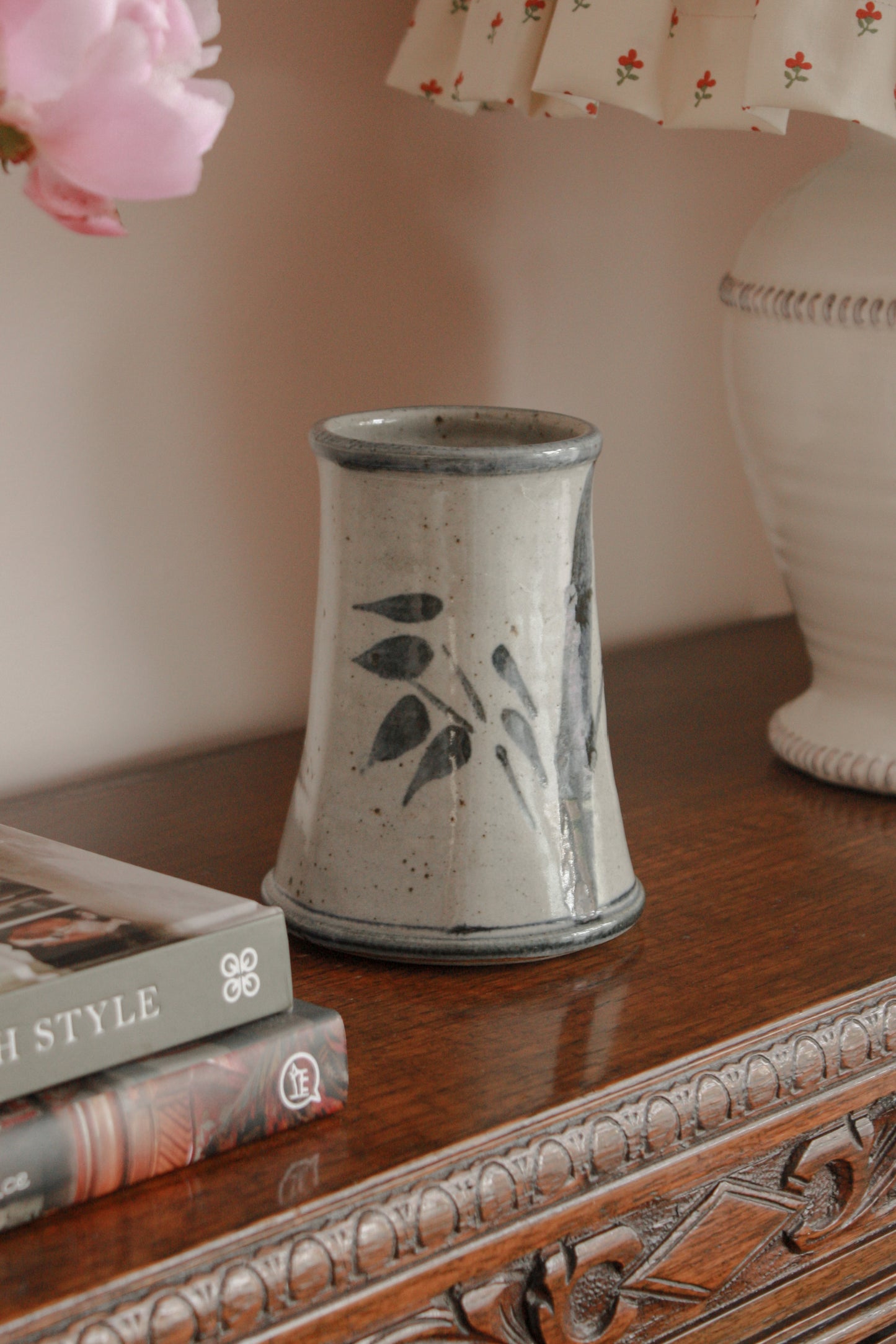 Rustic studio pottery vase with blue foliage details