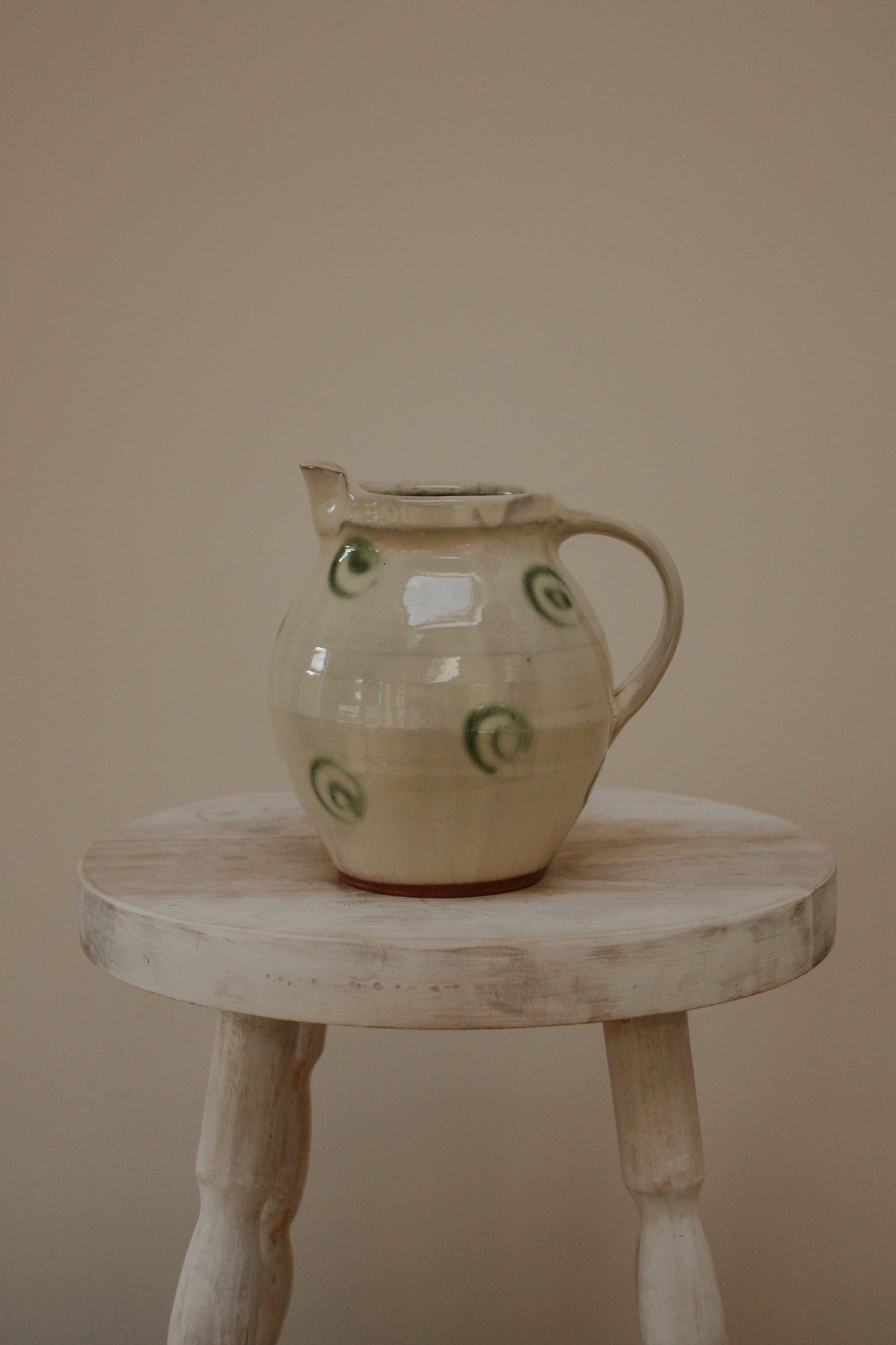 Vintage art pottery jug with swirl design