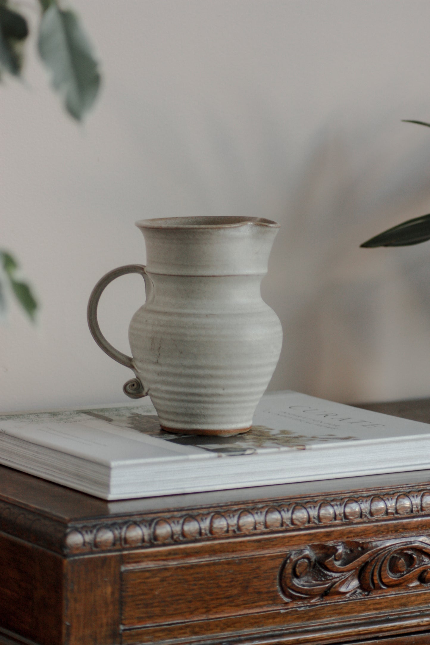 Vintage studio pottery pitcher with rustic glaze