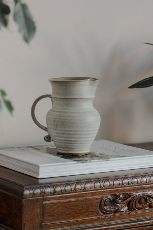 Vintage studio pottery pitcher with rustic glaze