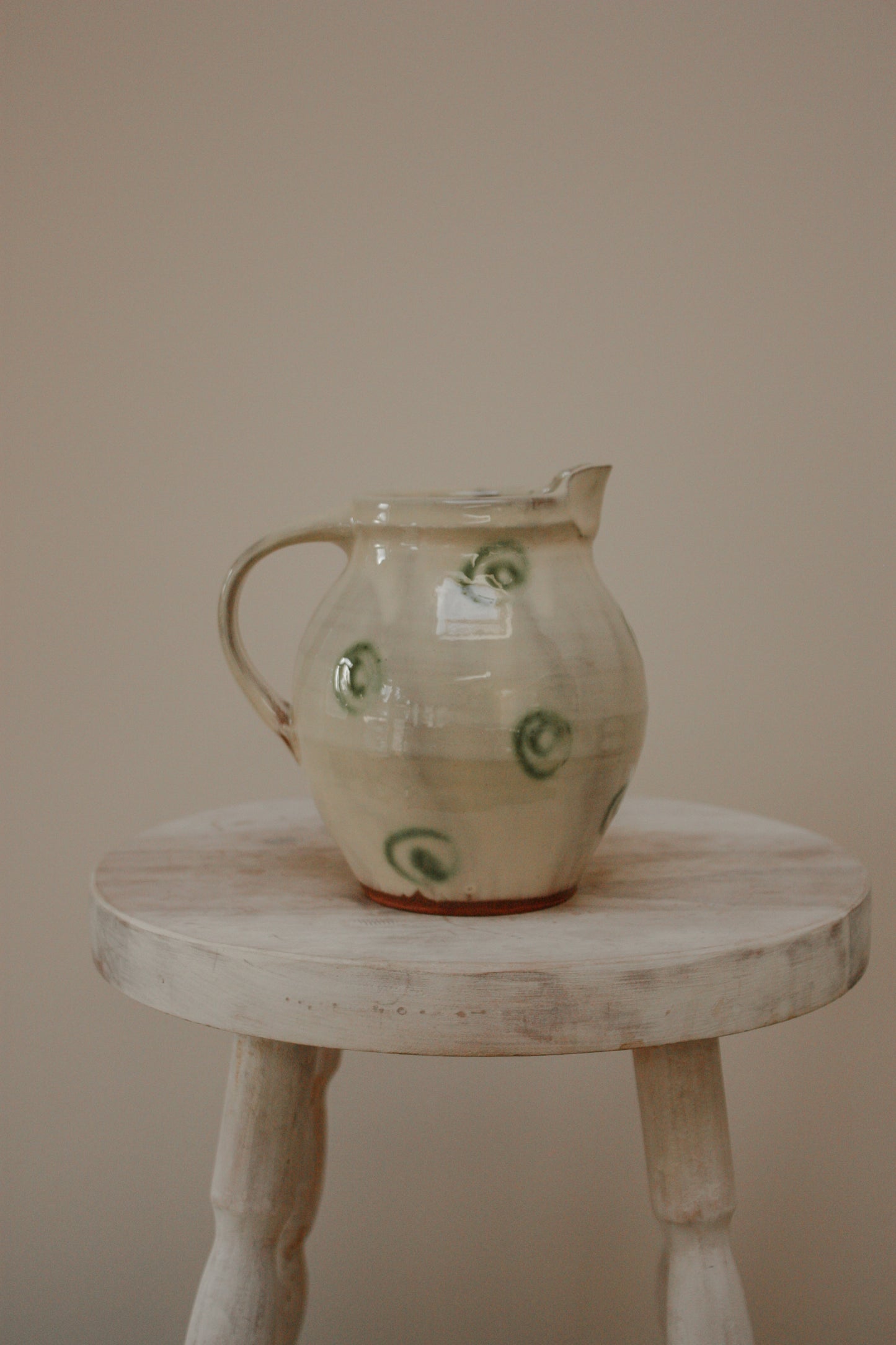 Vintage art pottery jug with swirl design