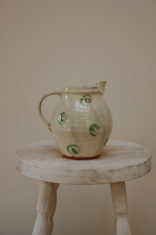 Vintage art pottery jug with swirl design