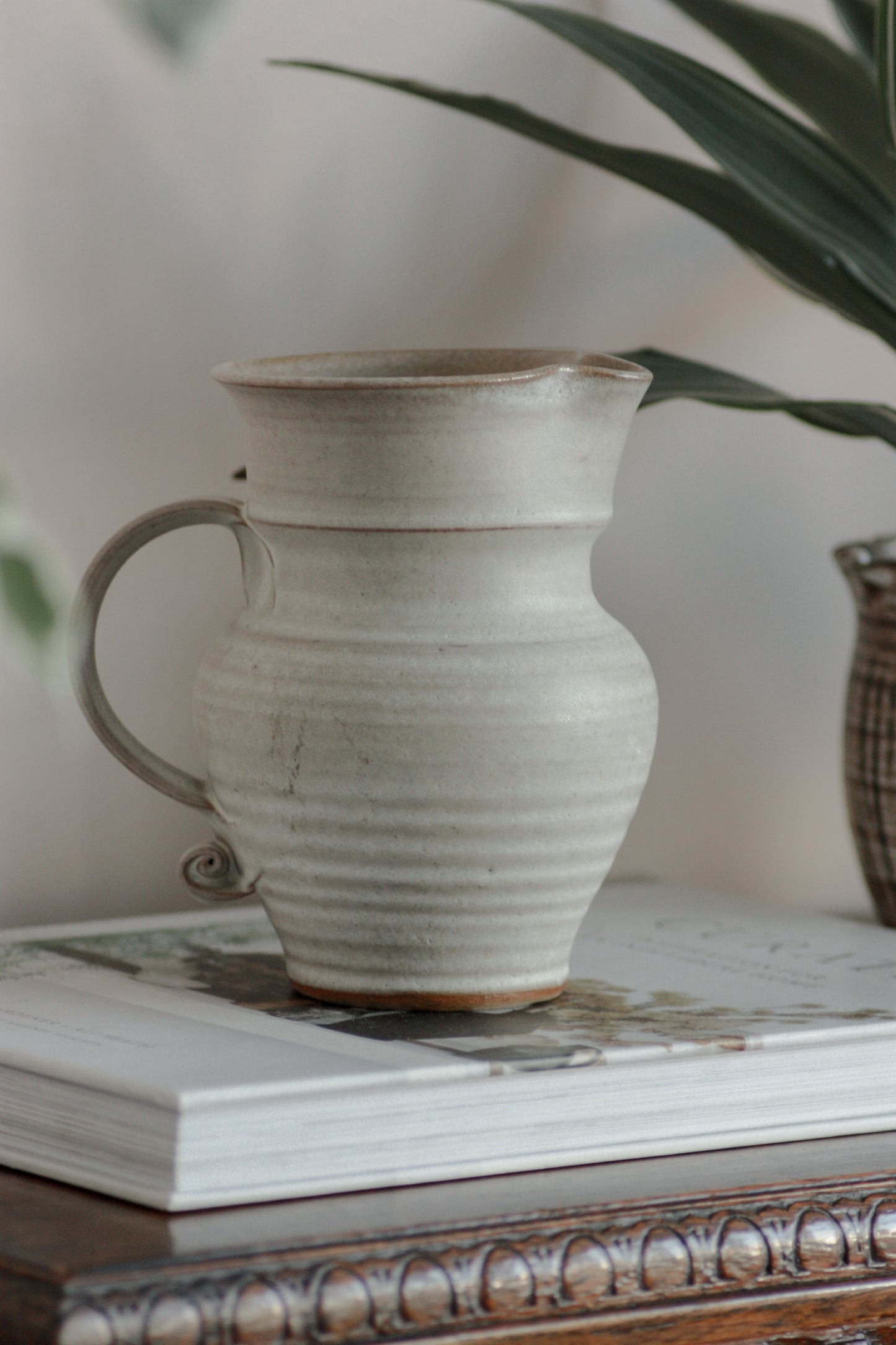 Vintage studio pottery pitcher with rustic glaze