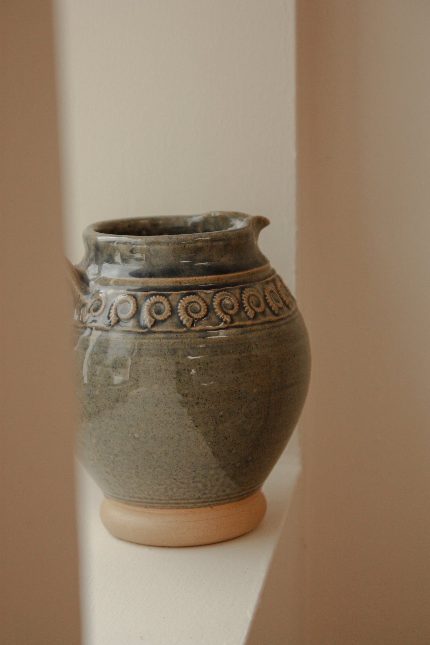 Studio pottery ammonite pitcher