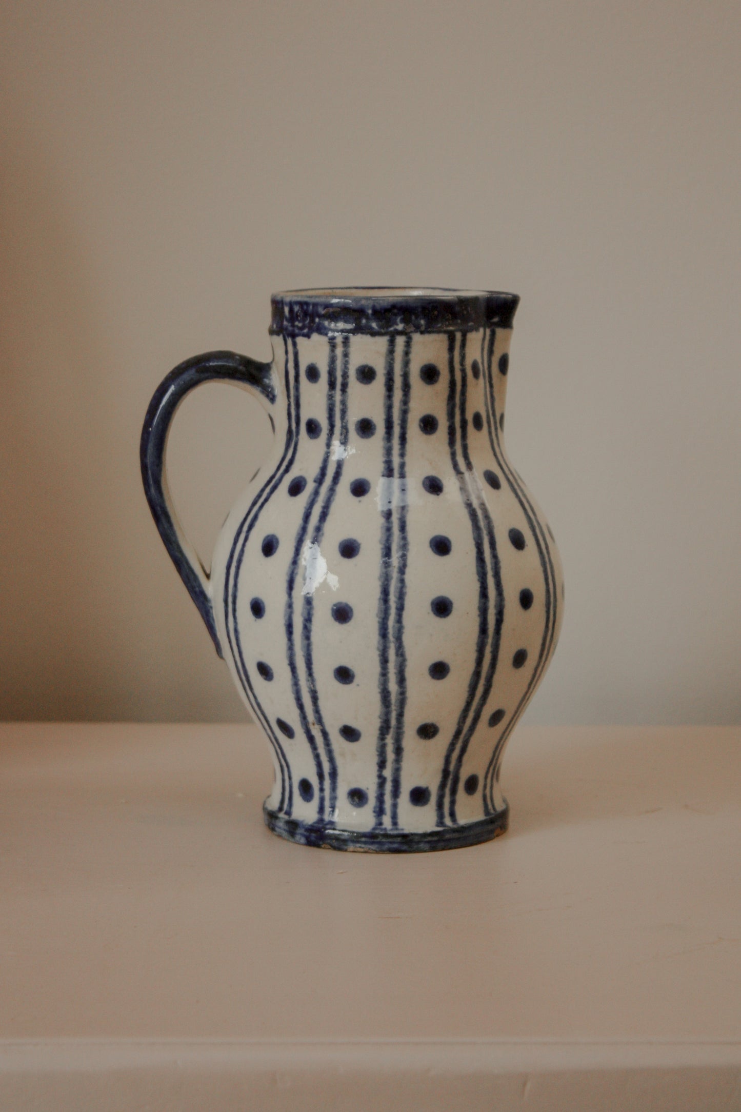 Vintage blue and white pottery pitcher