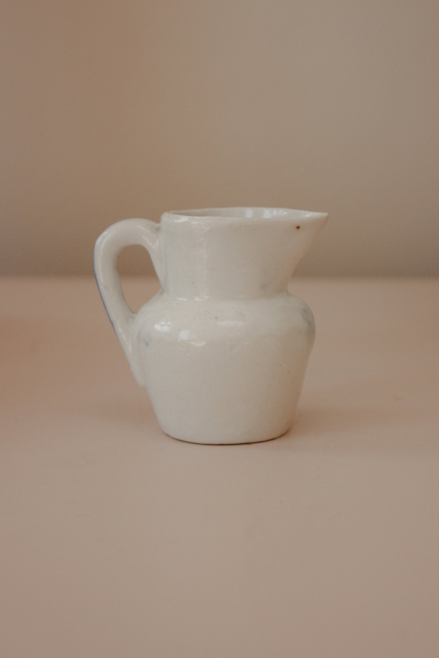 Vintage porcelain creamer with hand painted ship design