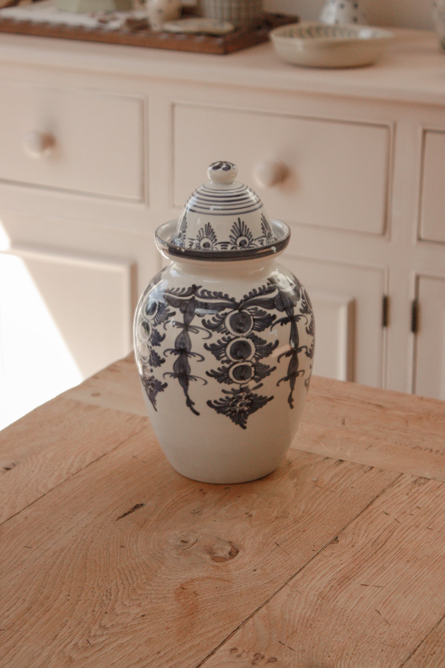 Vintage hand painted blue and white urn
