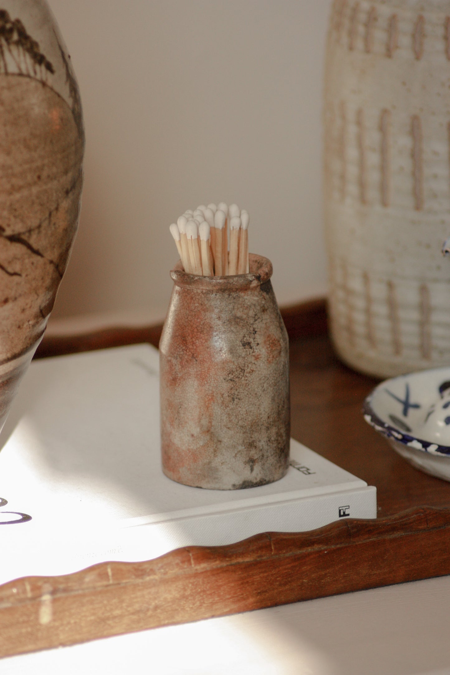 Vintage weathered and worn stoneware match pot