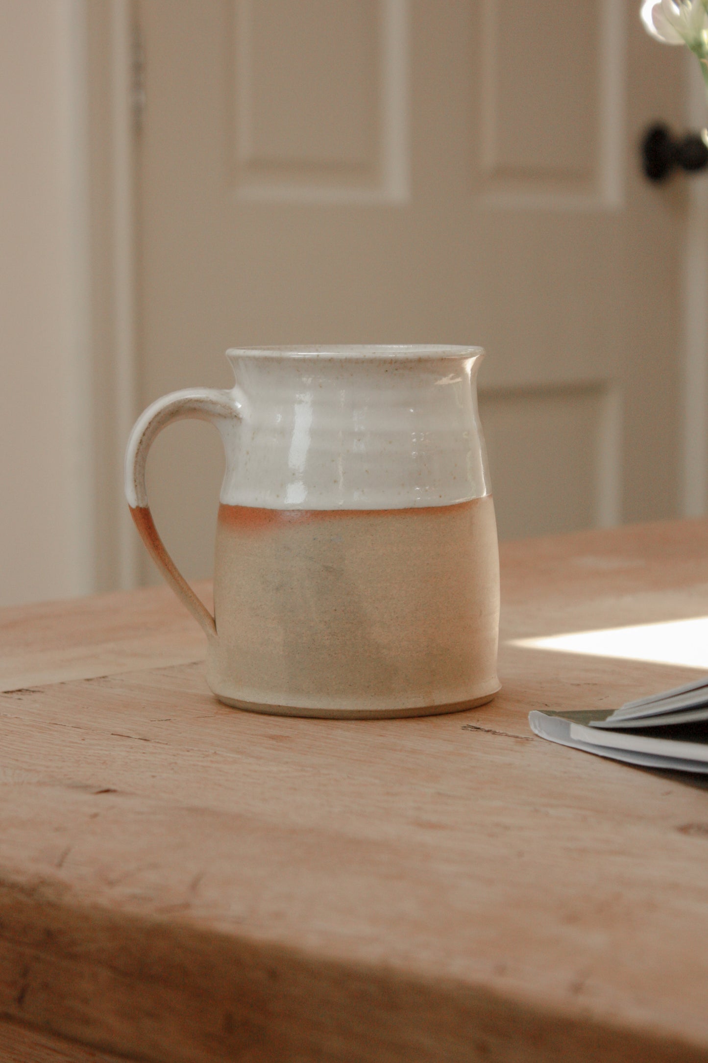 Studio pottery clay mug with rustic two tone glaze