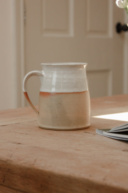Studio pottery clay mug with rustic two tone glaze