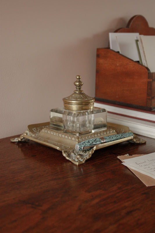 Antique ornate brass ink well with glass ink bottle