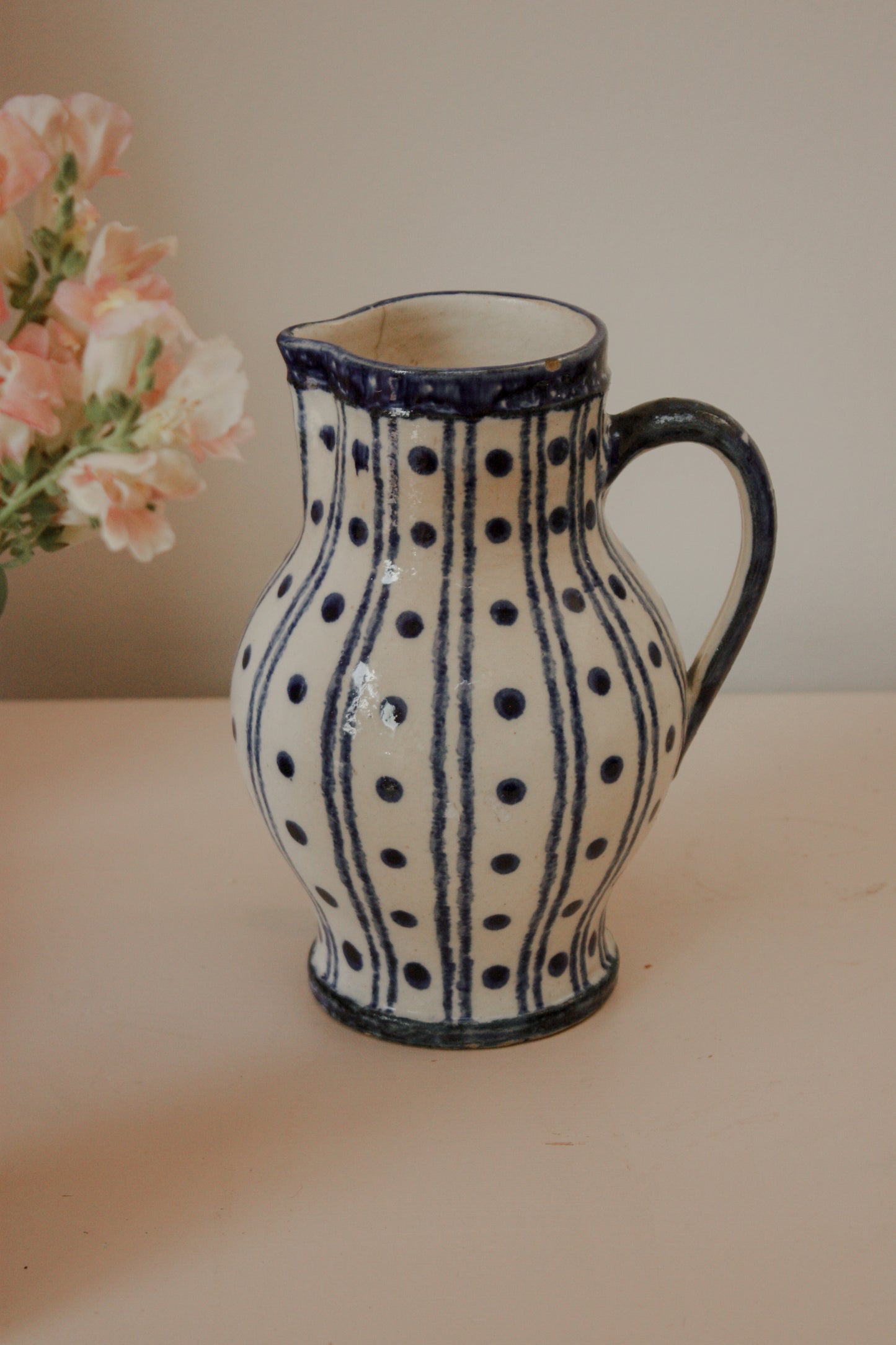 Vintage blue and white pottery pitcher